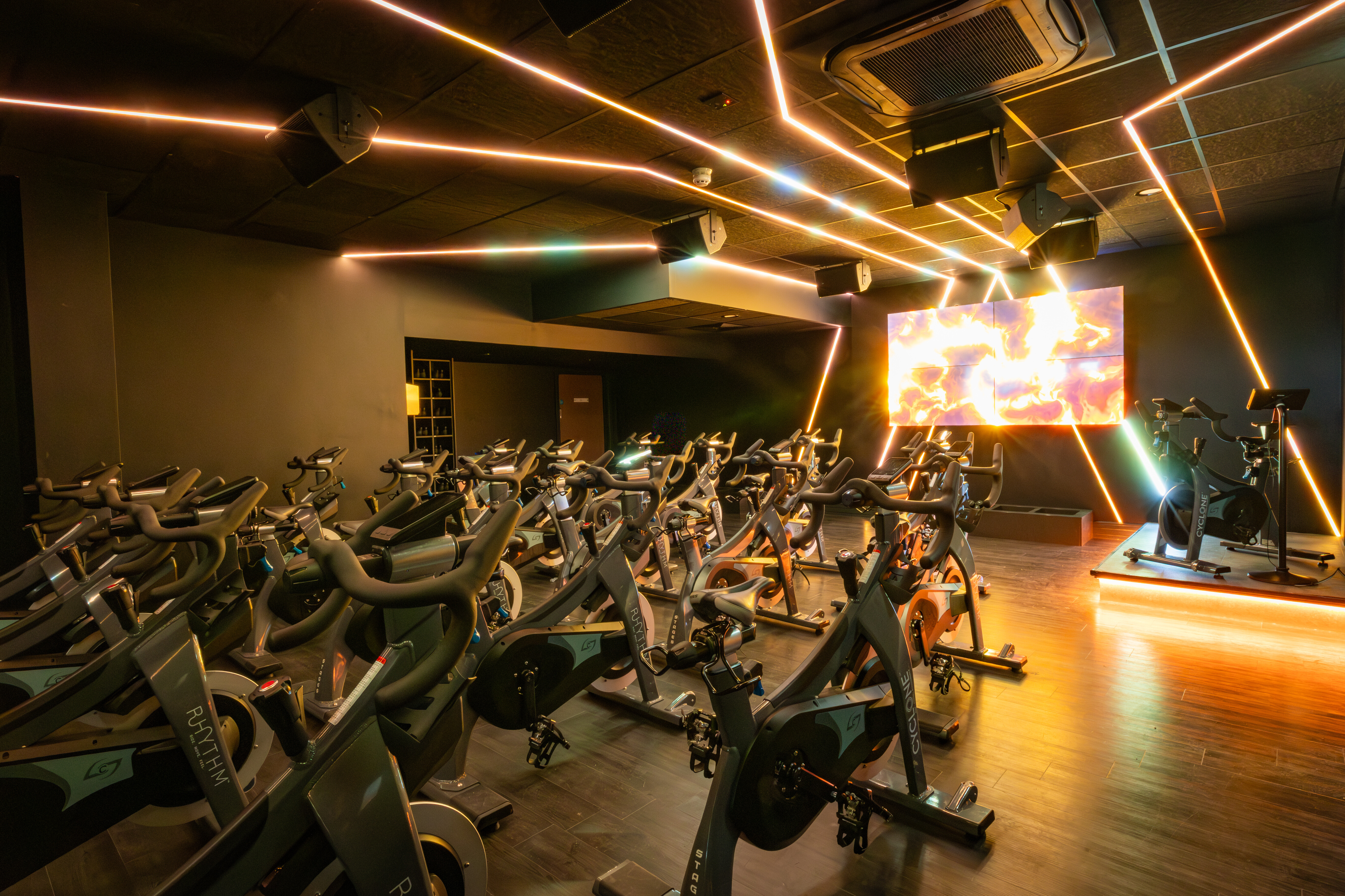 Rows of bikes facing a screen