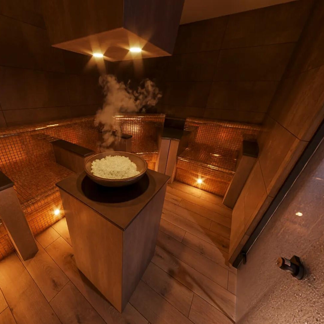 Steam rising from a bowl of ice in the amber glow of the Fire and Ice room