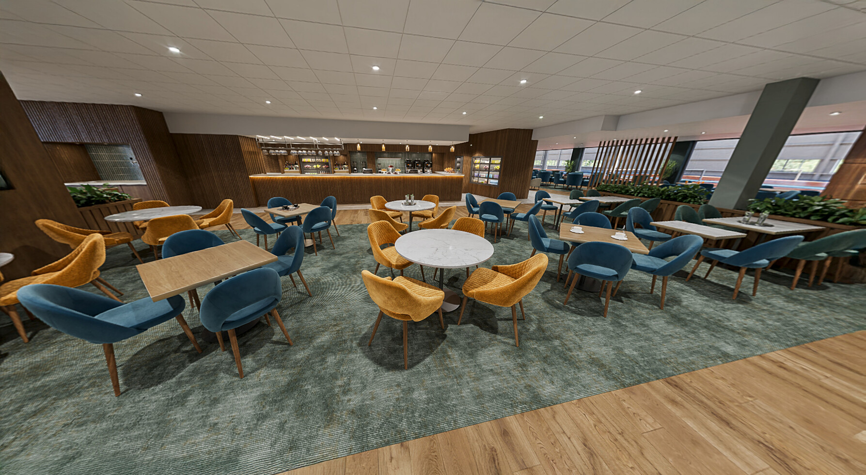 Teal and yellow chairs at tables in the Clubroom