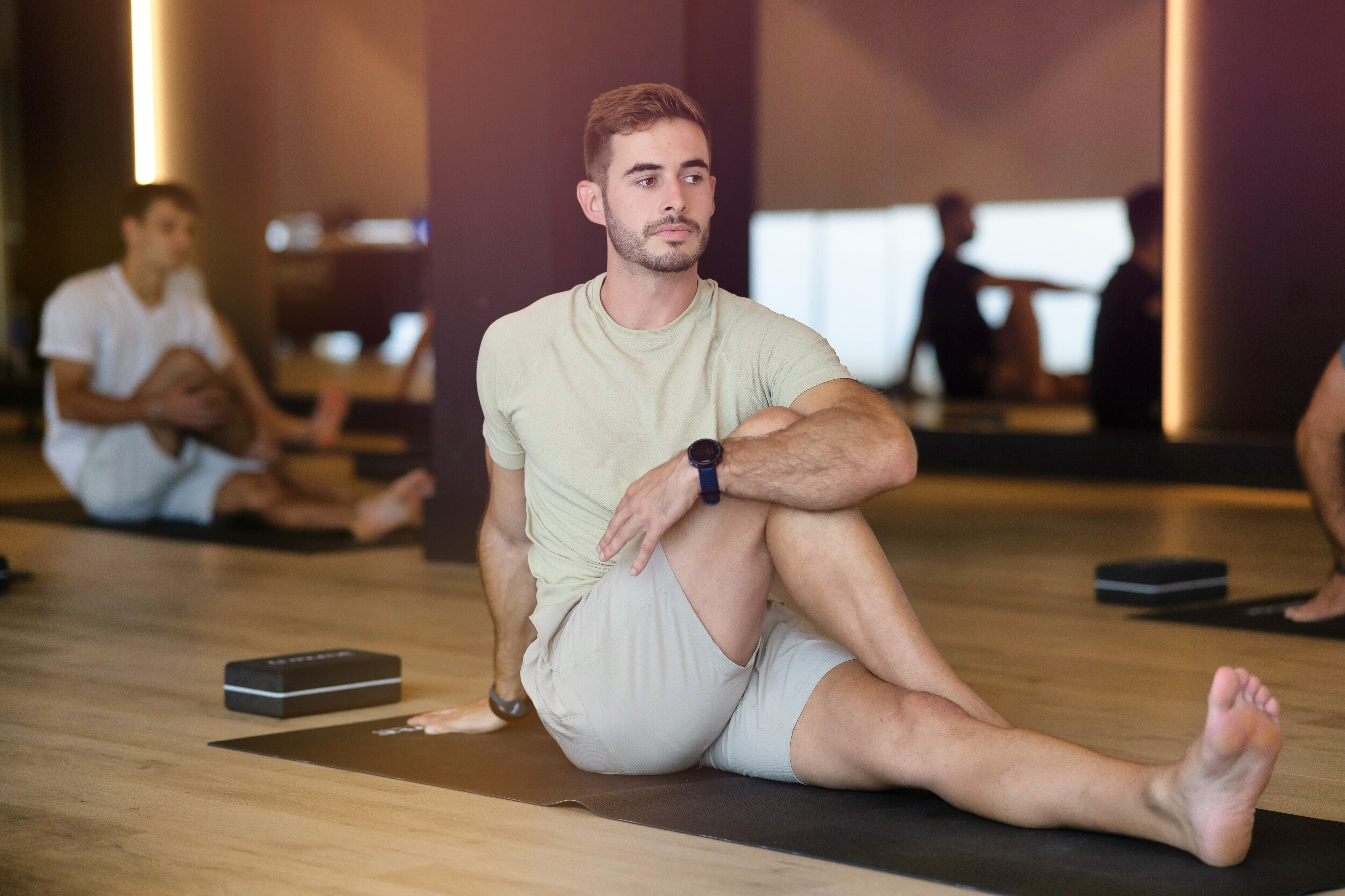 A man stretching in a Mind & Body studio