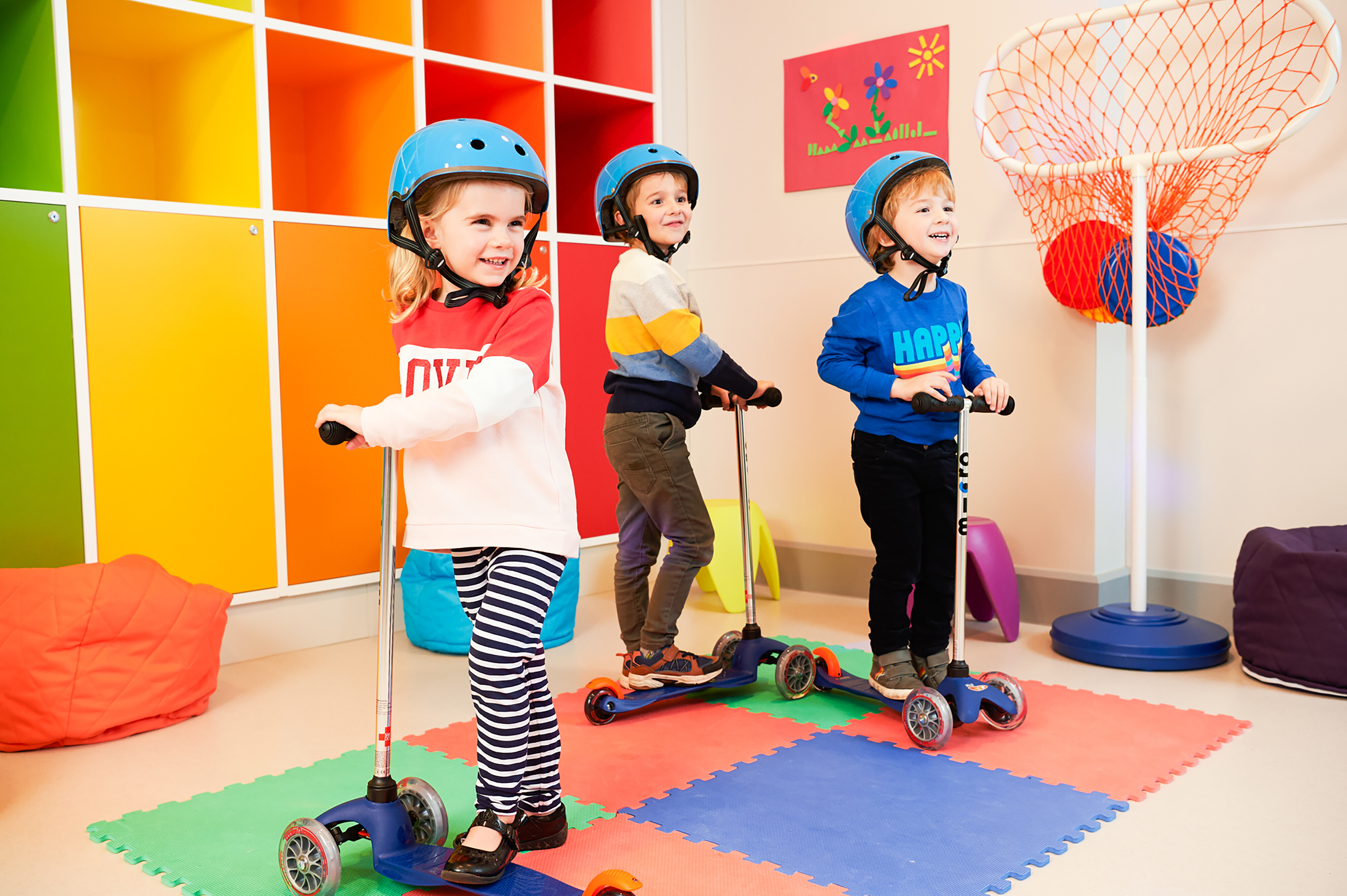 A group of children on scooters