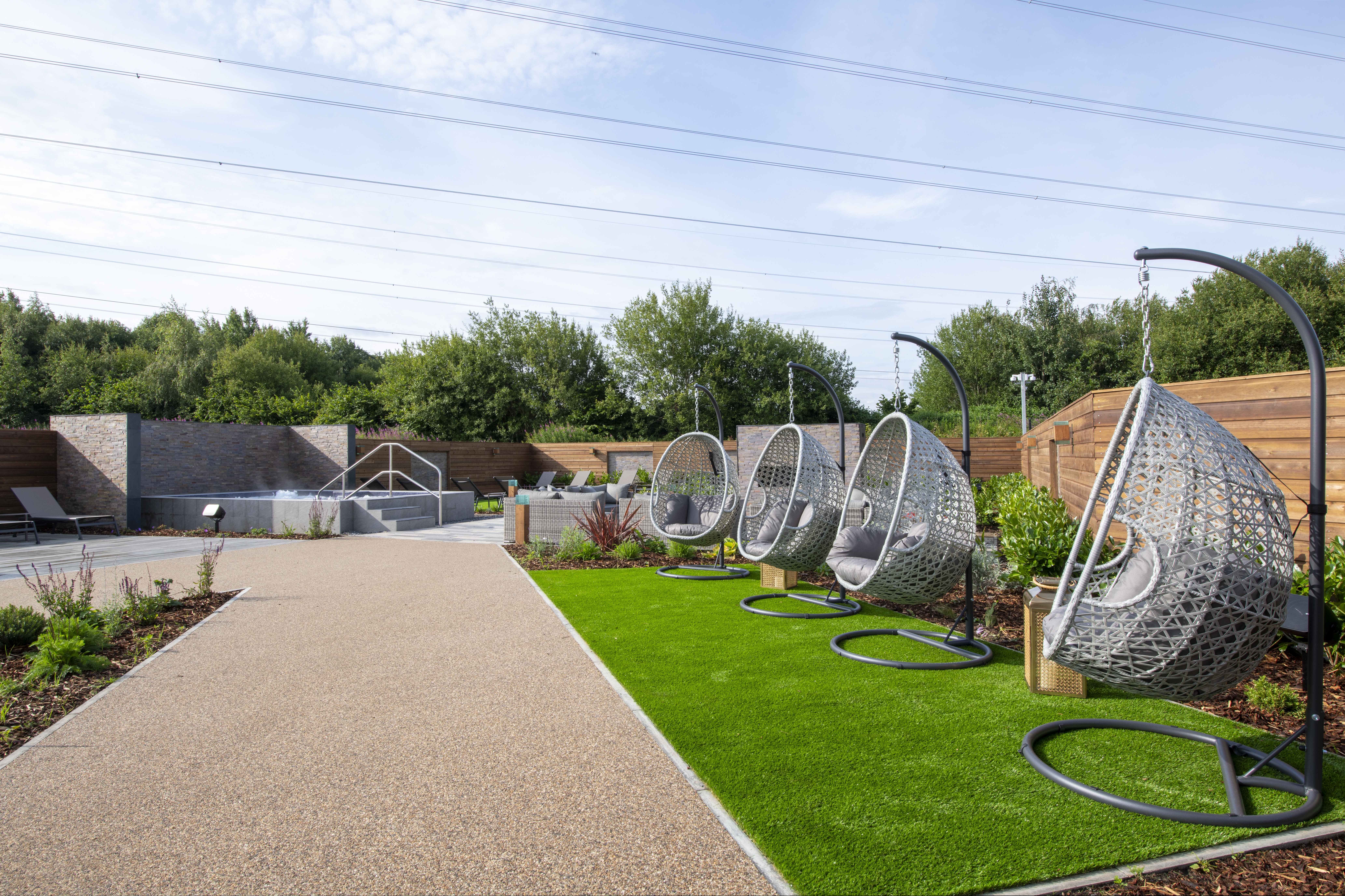 Comfy chairs and cocooning pods in our Spa Garden