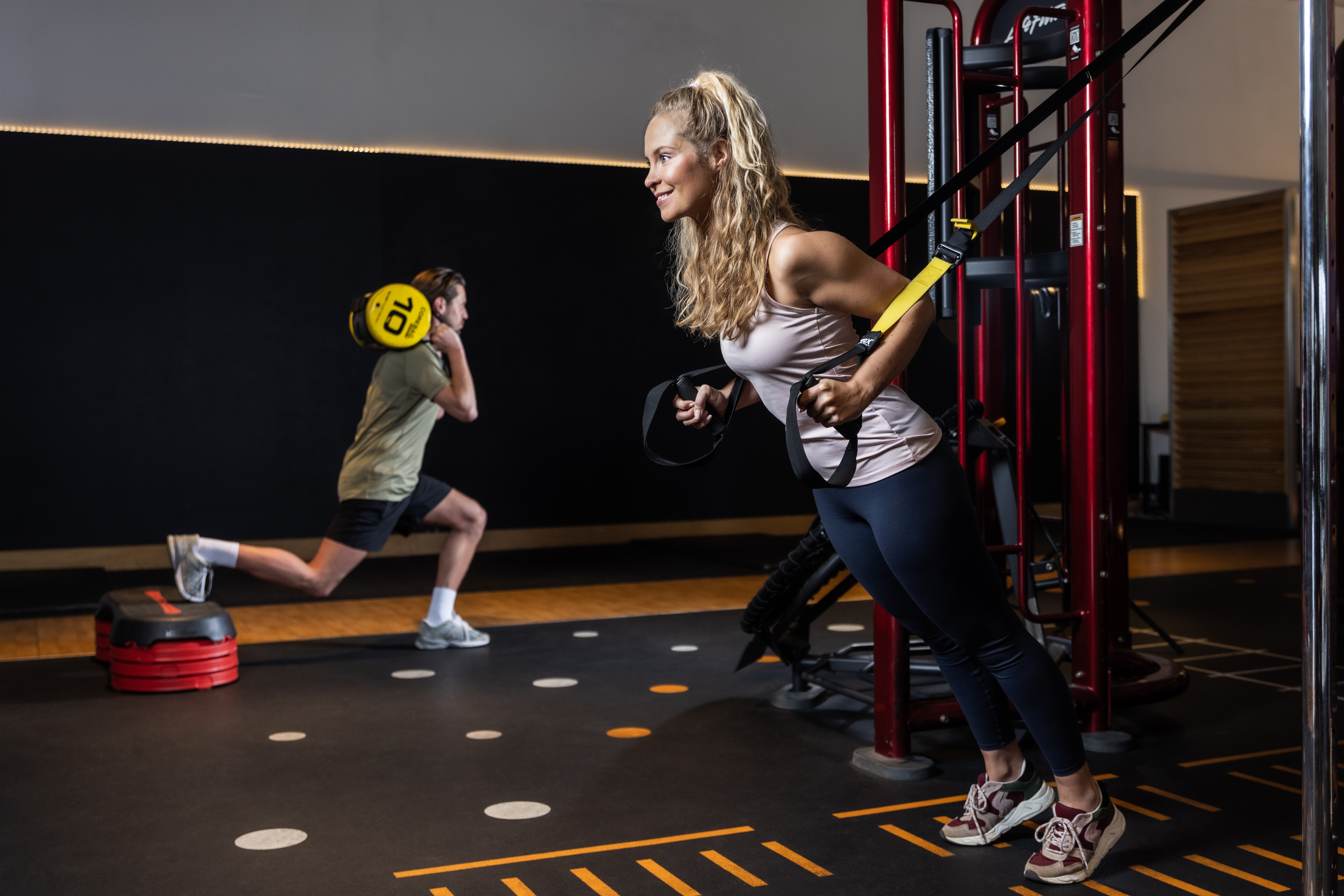 A woman working out with a personal trainer