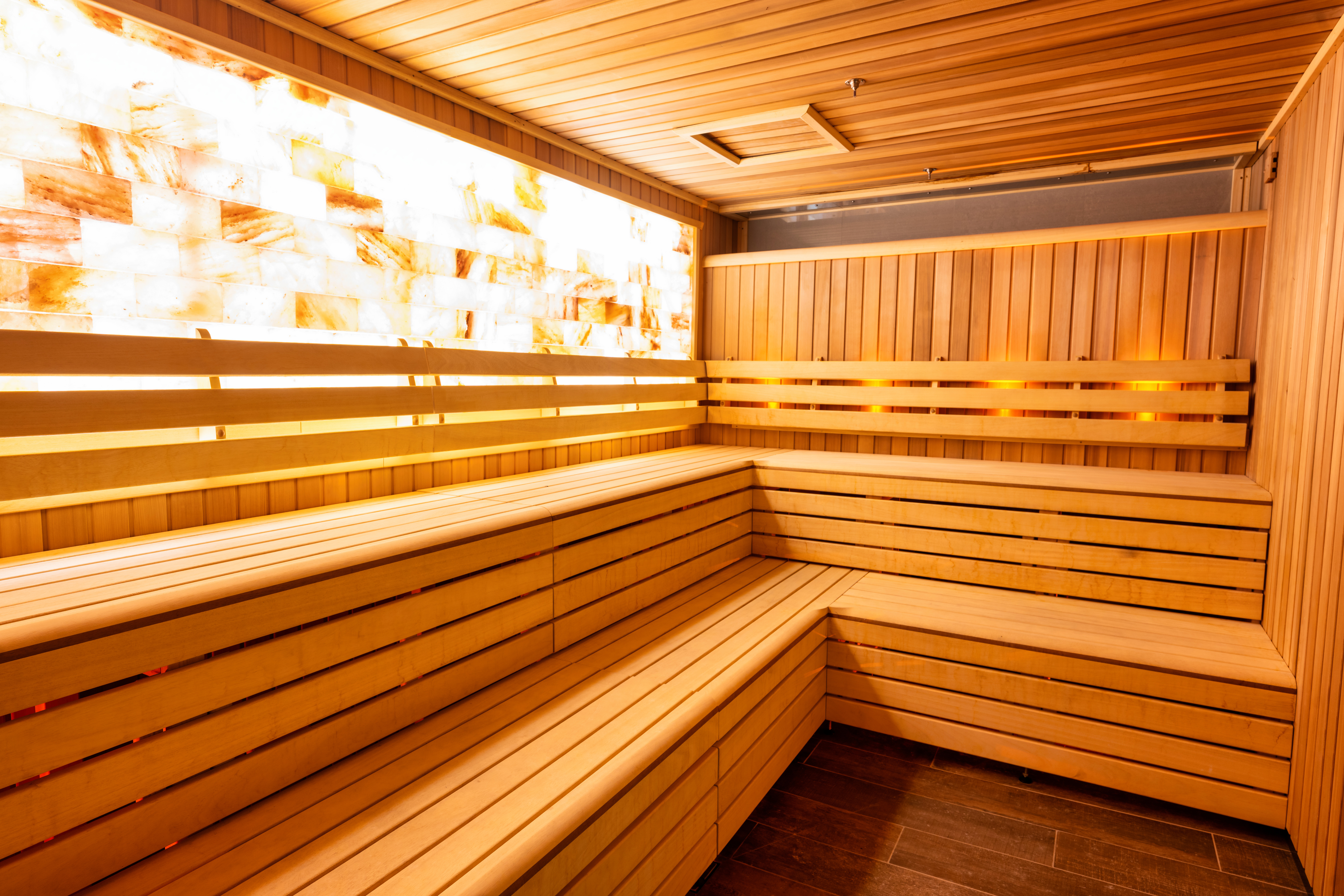 Himalayan salt sauna with wooden benches
