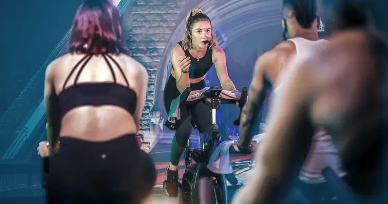 People in group cycling class
