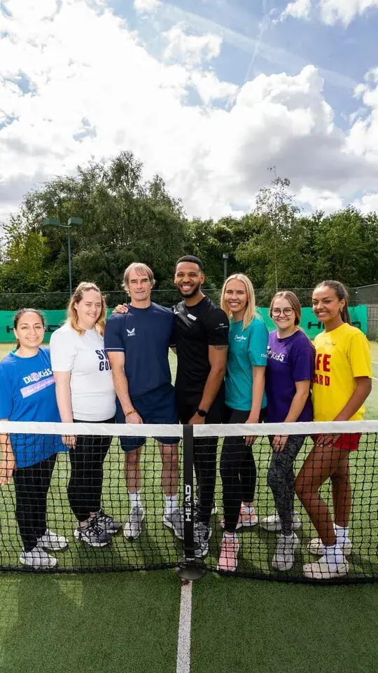 Team members on a tennis court