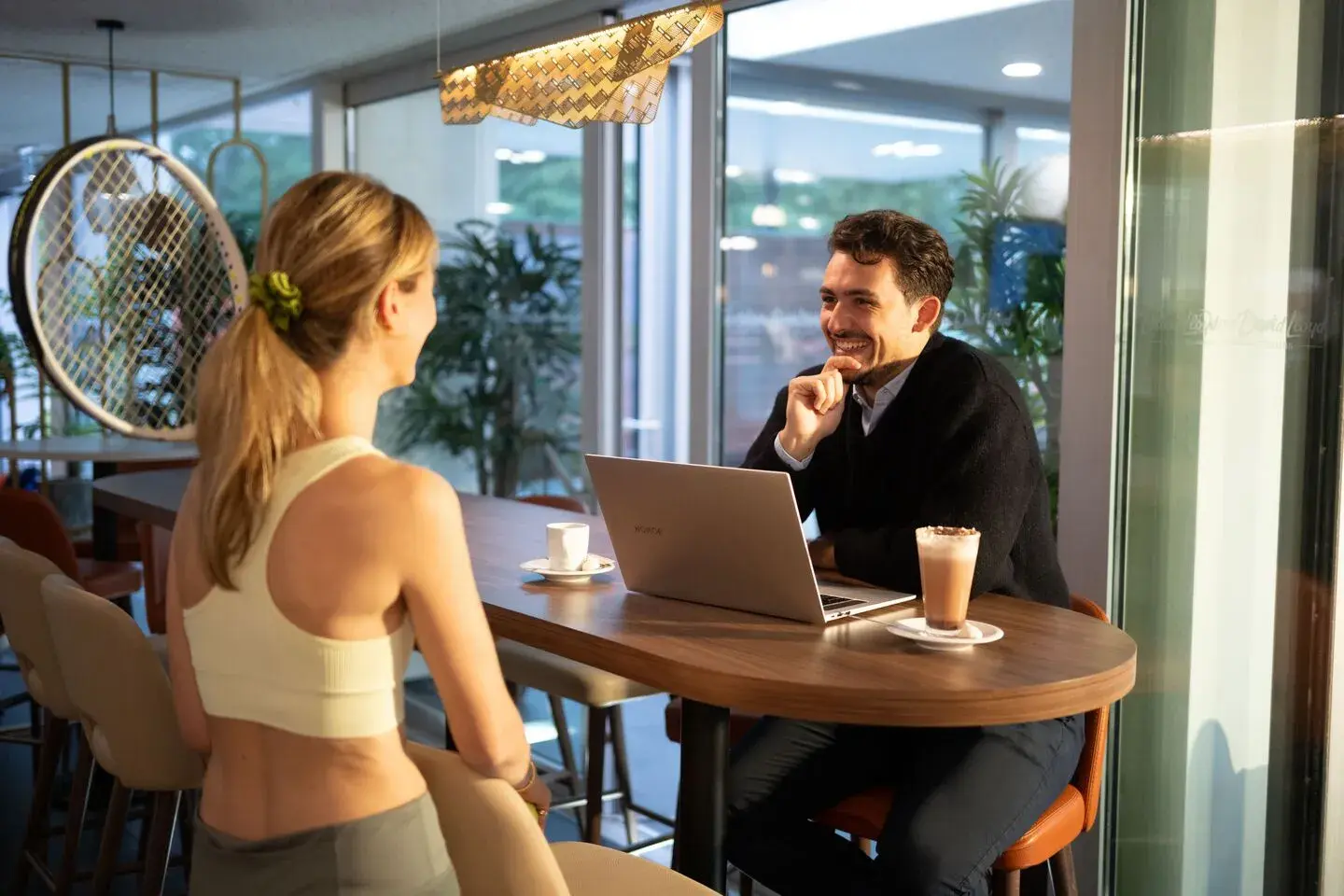 Man and woman chatting over a coffee