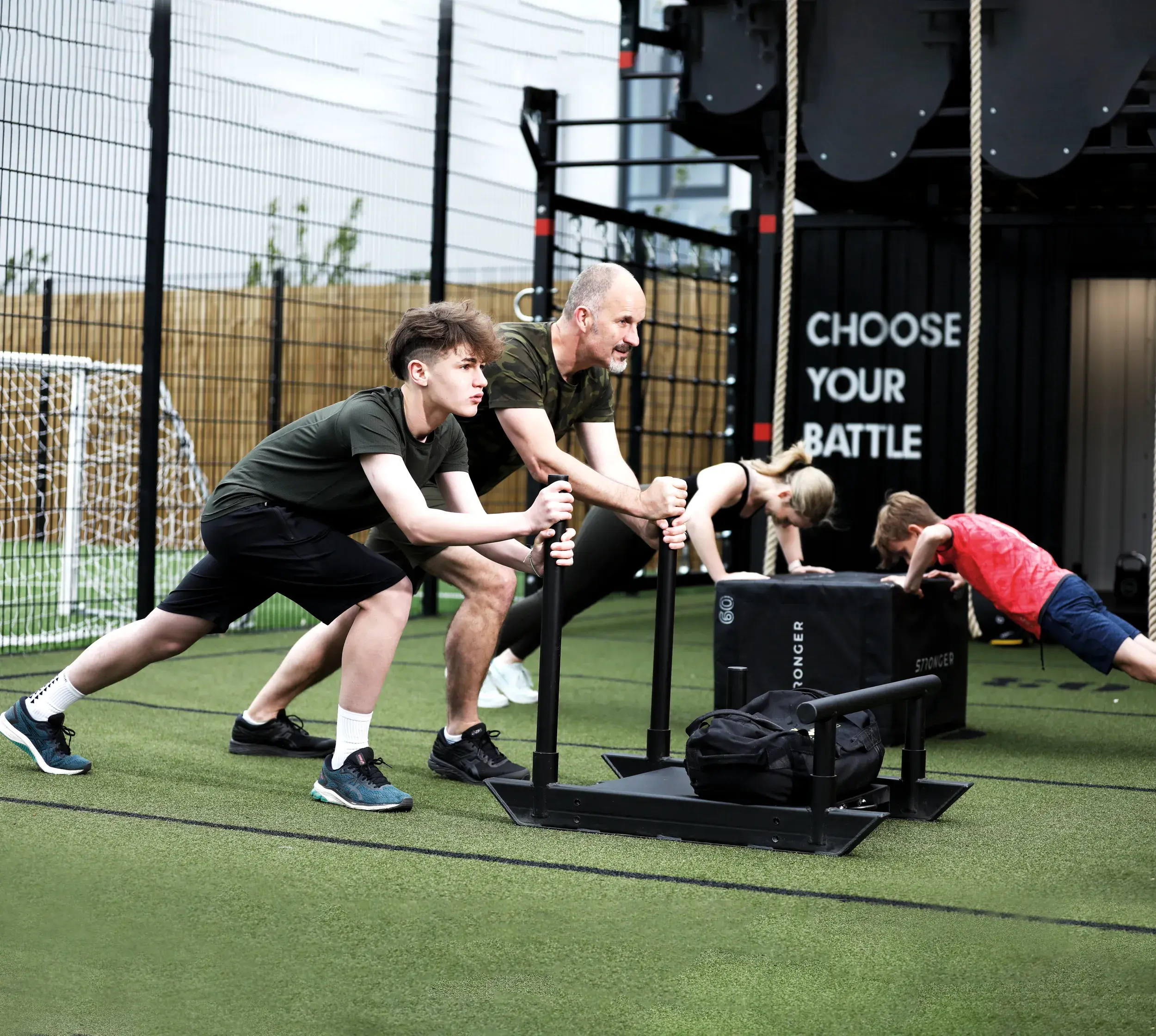 Kids pushing a sled