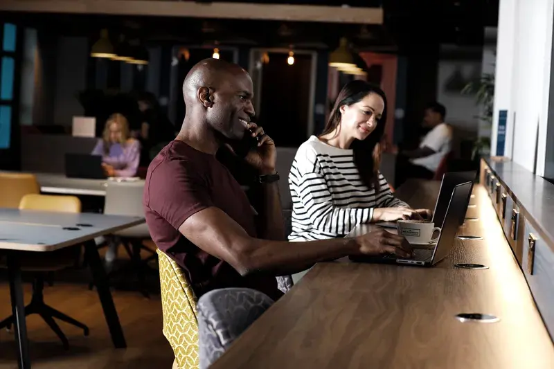 Two people working in the club
