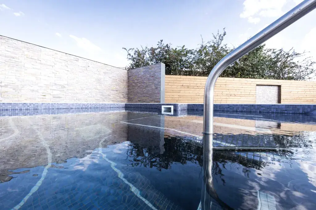 An outdoor hydro pool at a David Lloyd Clubs spa garden.