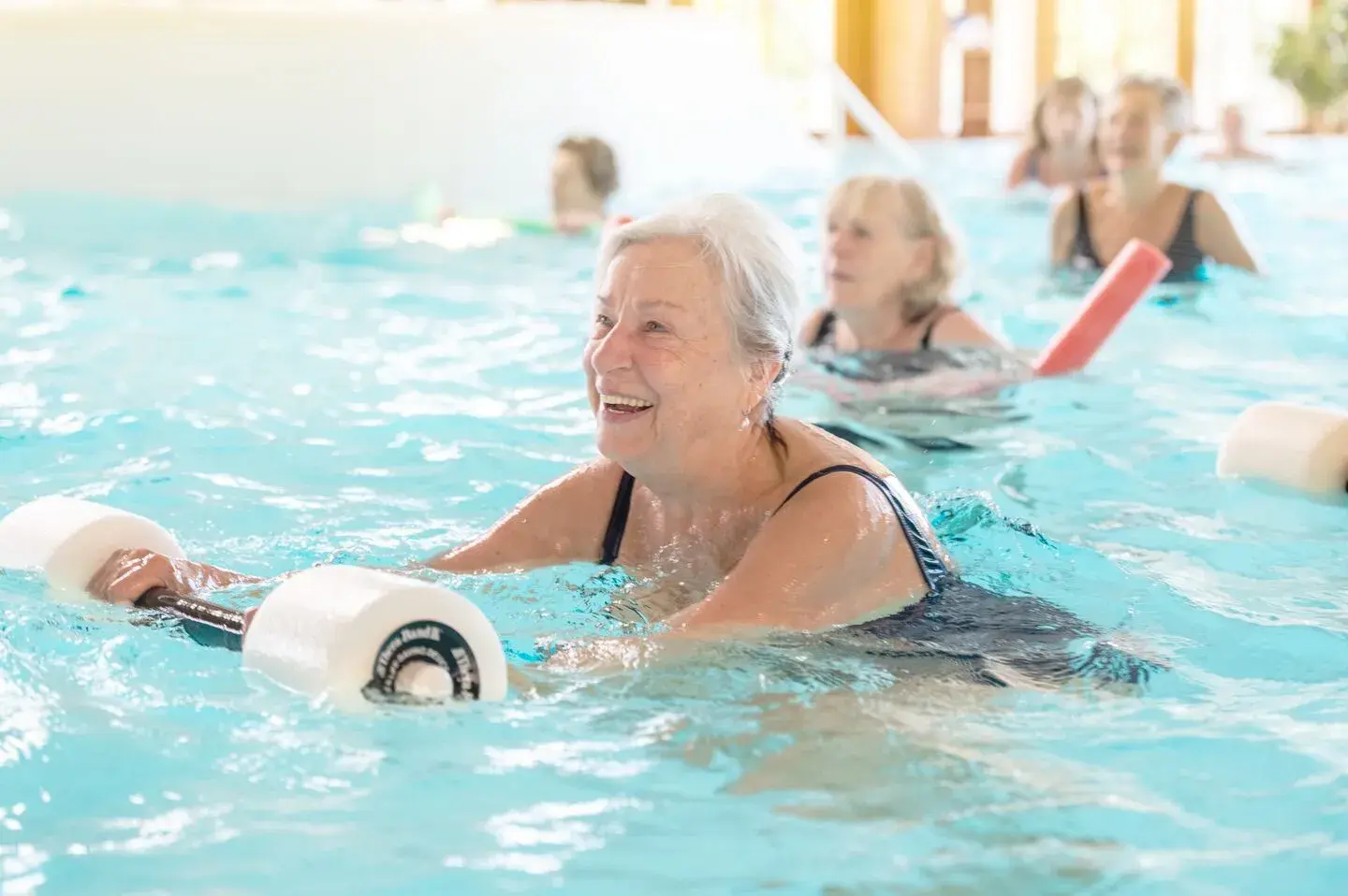 Woman enjoying aqua aerobics