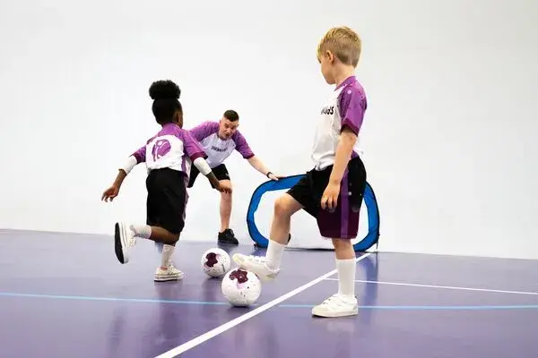 Children playing football at David Lloyd Kingston