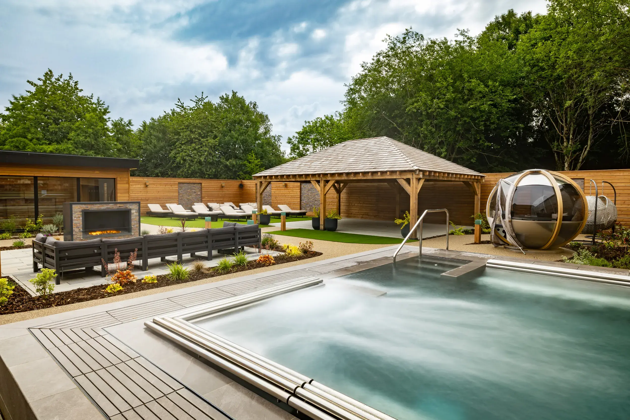 Outdoor spa garden seating area and hydro pool
