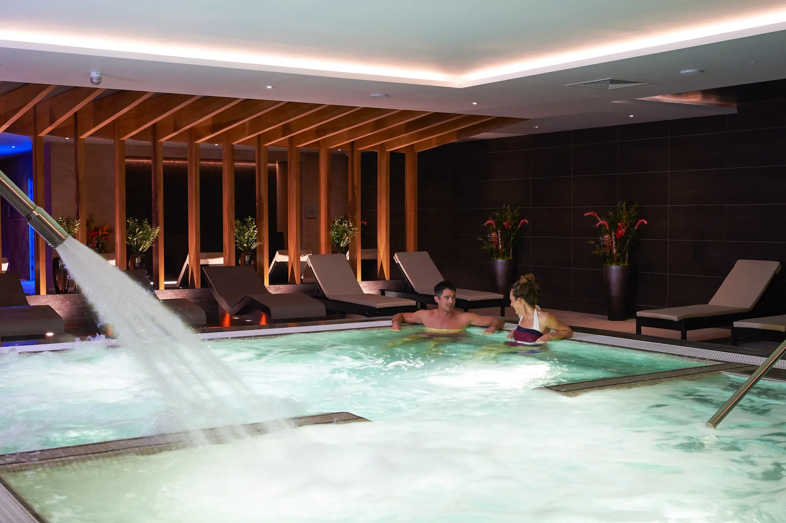 Two people in the hydro pool at David LLoyd Cambridge