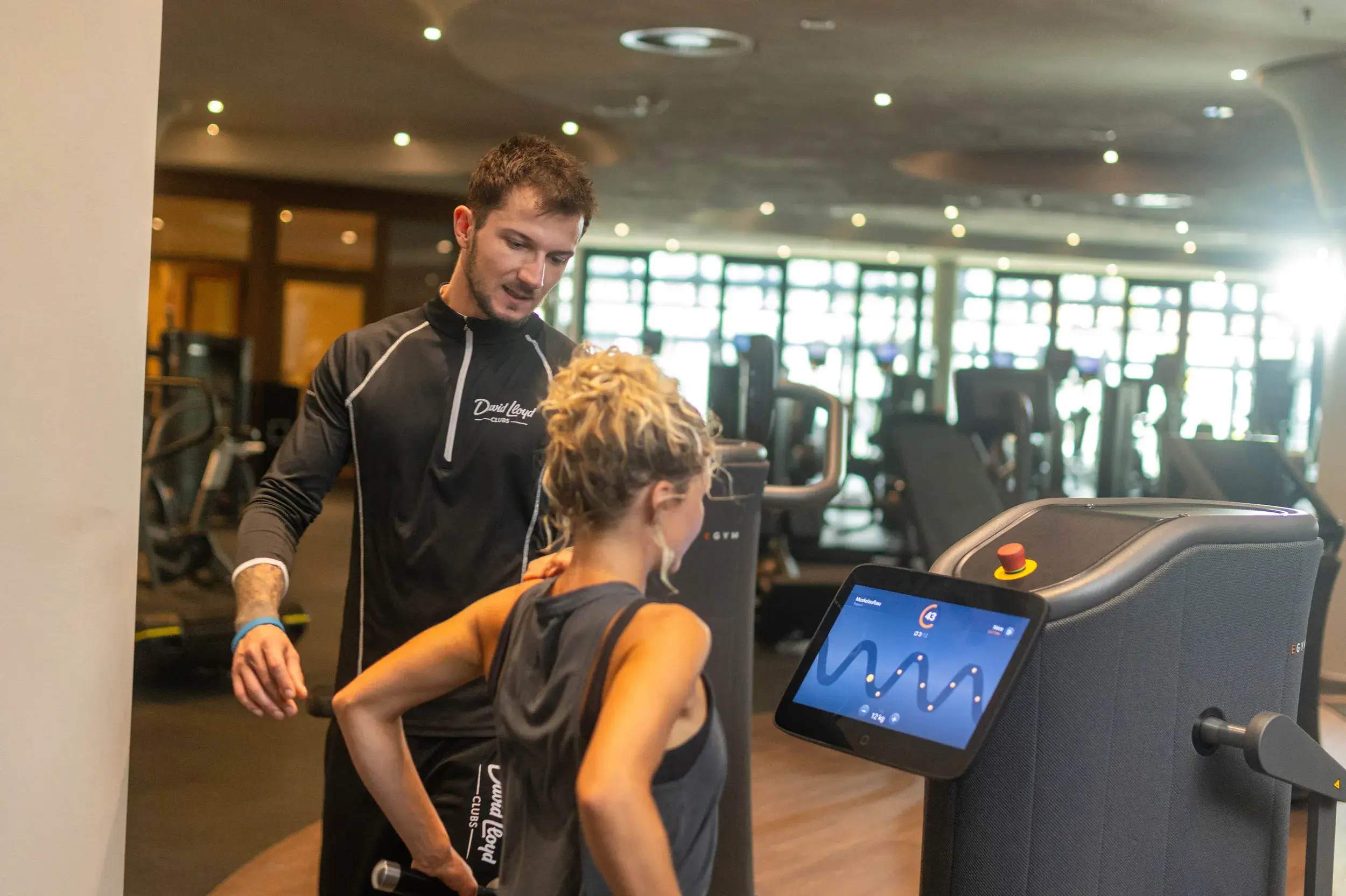 A teen being advised by a PT