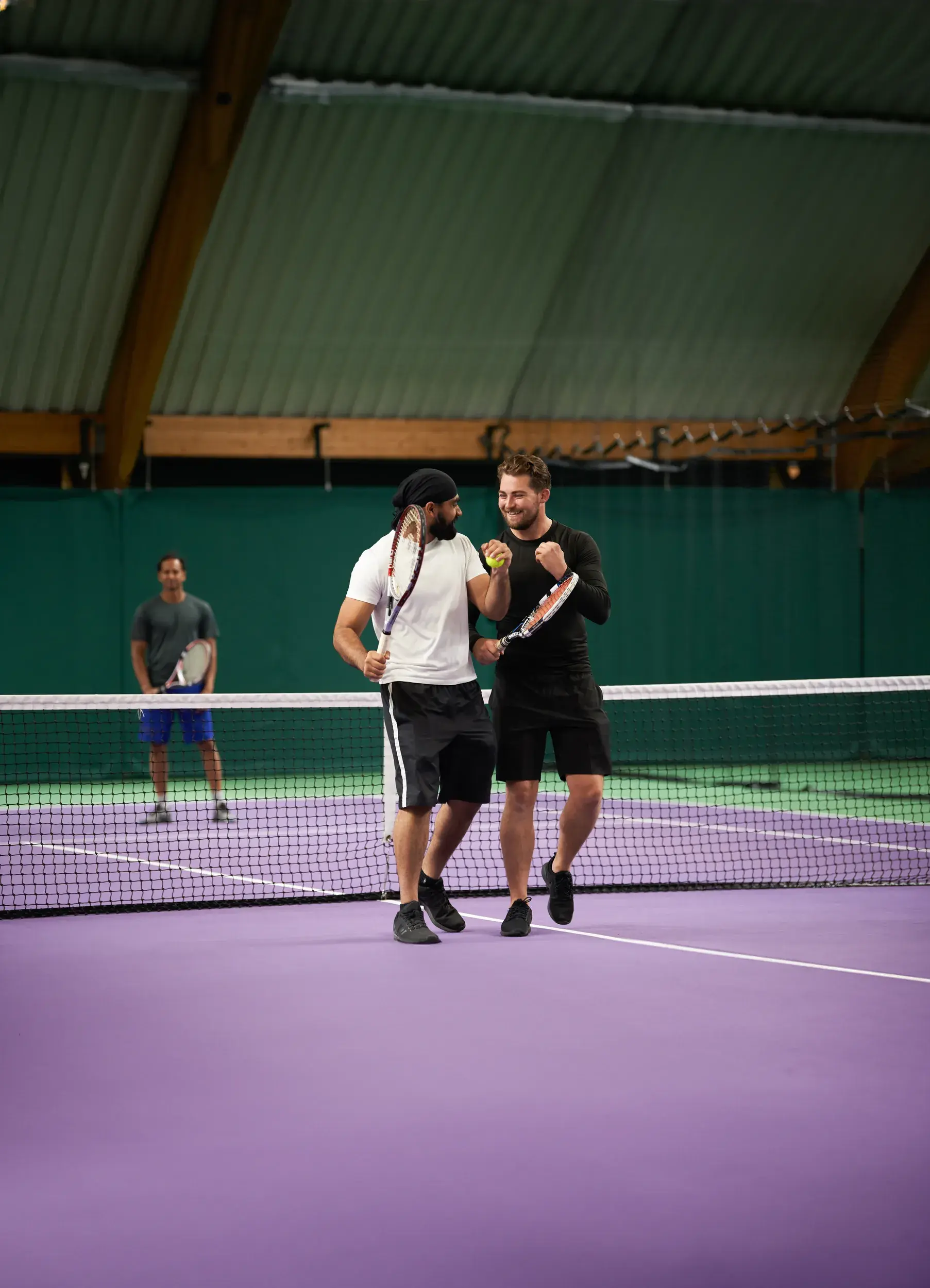Two people on a tennis court