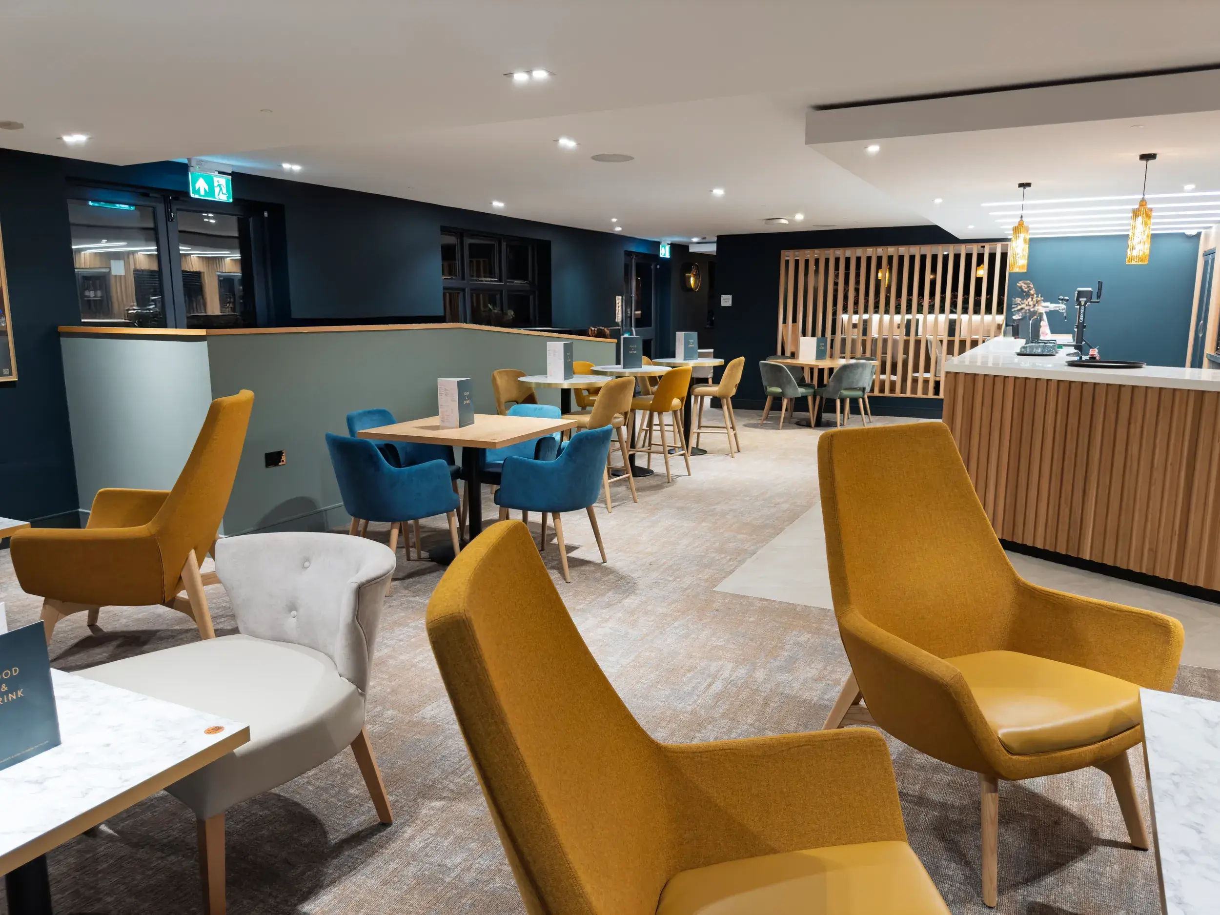 Chairs arranged around tables in the Clubroom