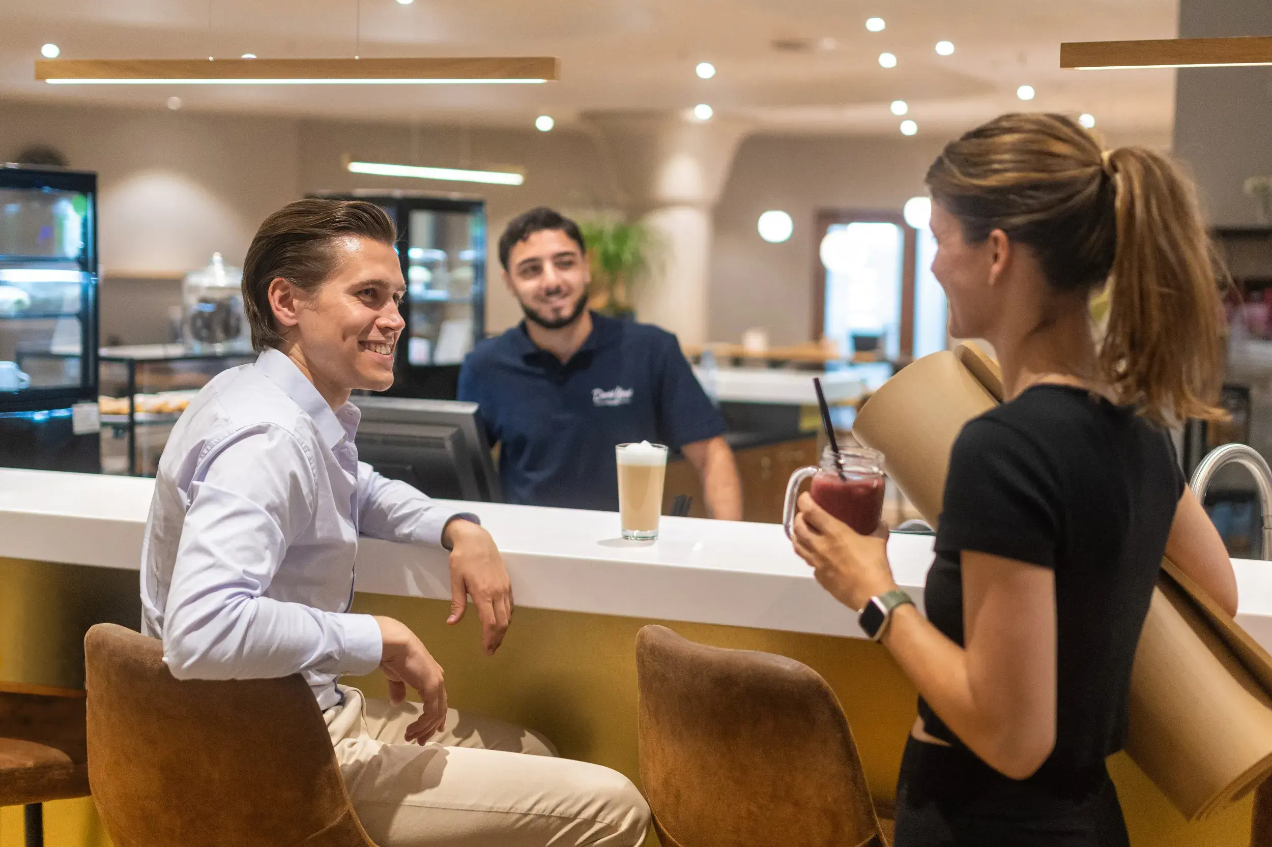 People enjoying a drink in the clubroom