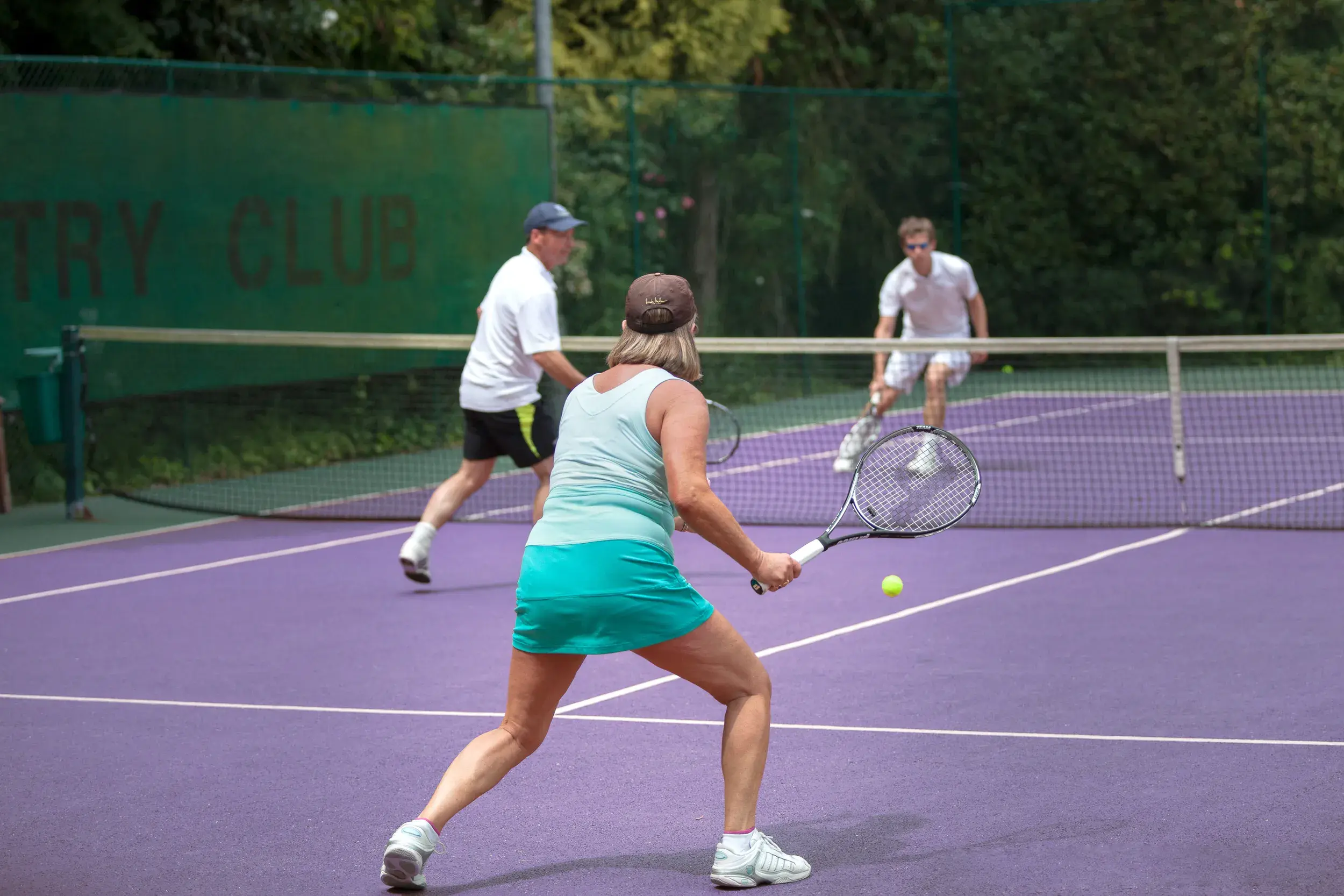 People playing a doubles tennis match