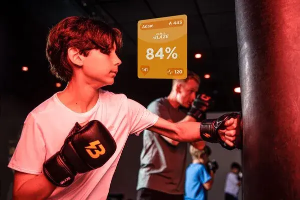 A young girl running on a treadmill in a Blaze Rebels class