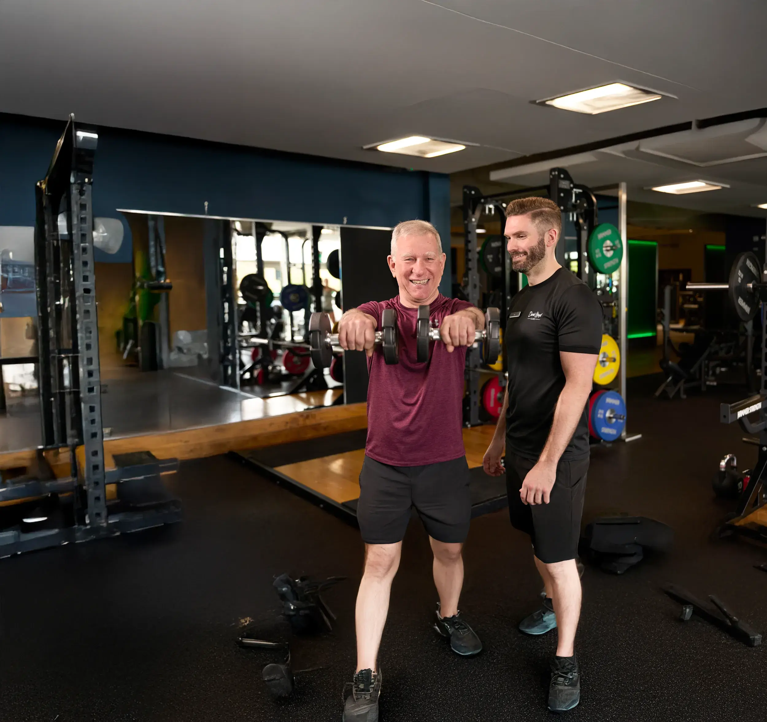 A personal trainer works with their client