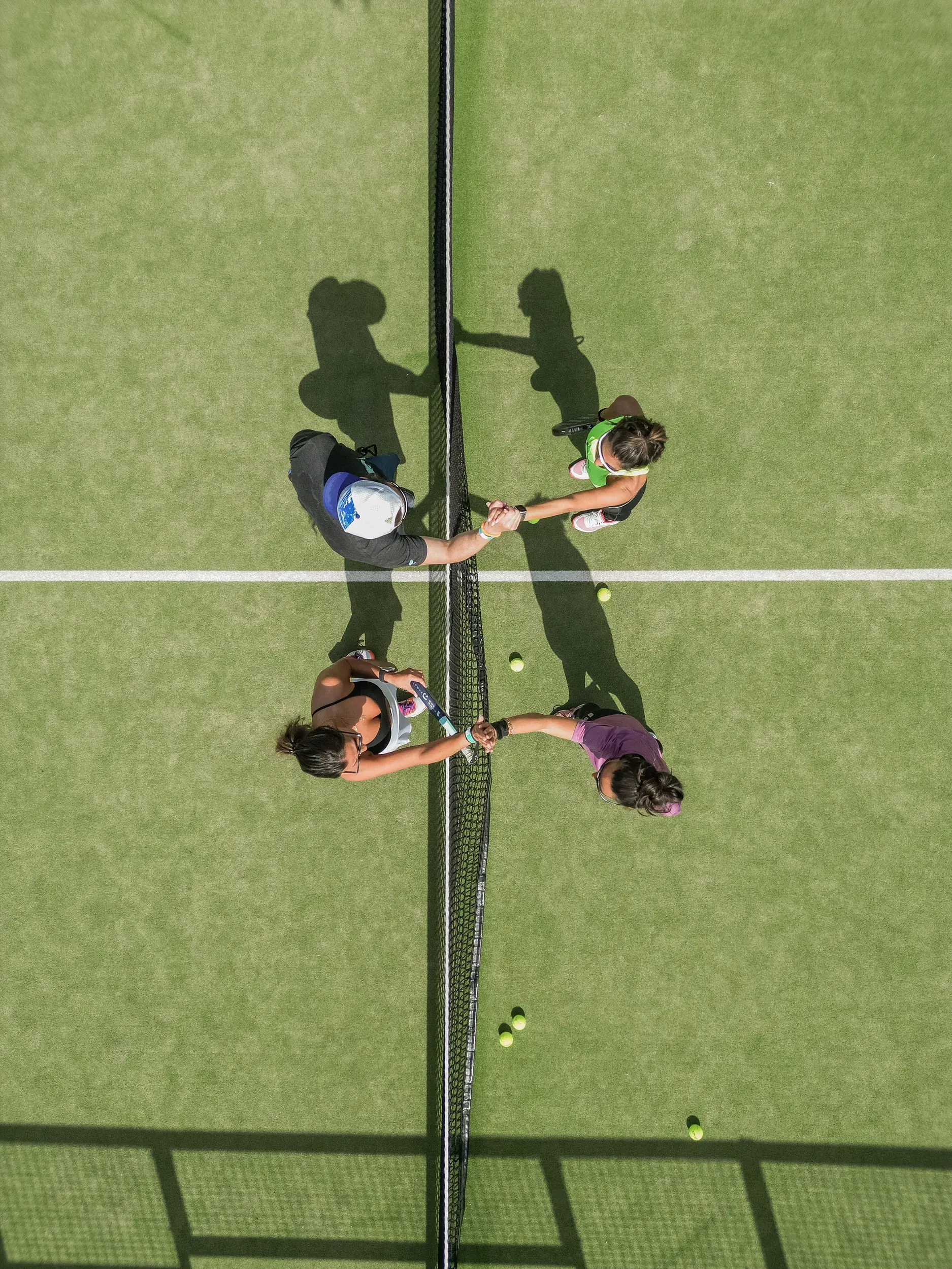 A woman playing tennis on an outdoor court
