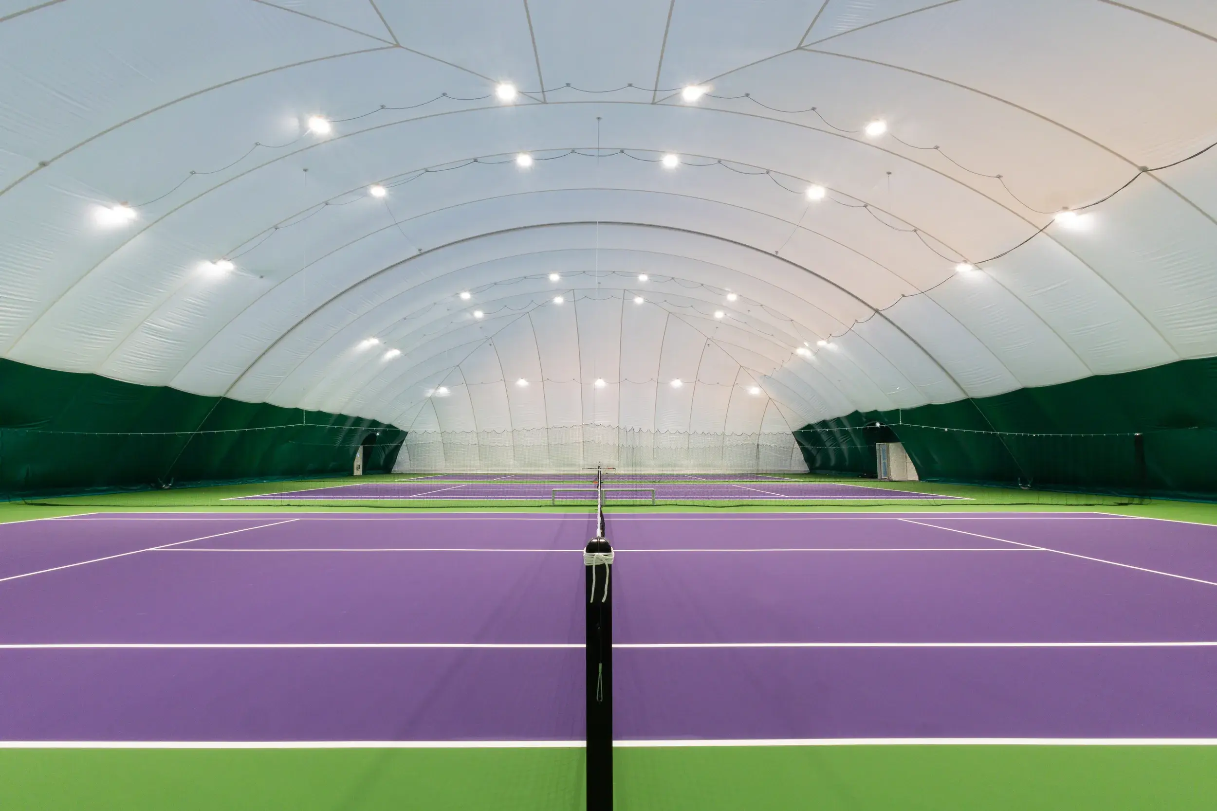 Outdoor tennis courts covered by a tennis dome 