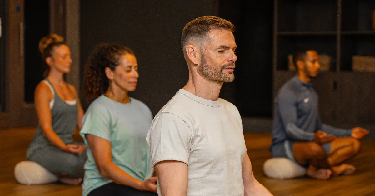 A group meditating in a class