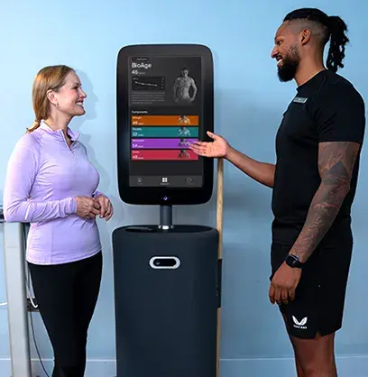 A personal trainer showing the Bodyhub to a member