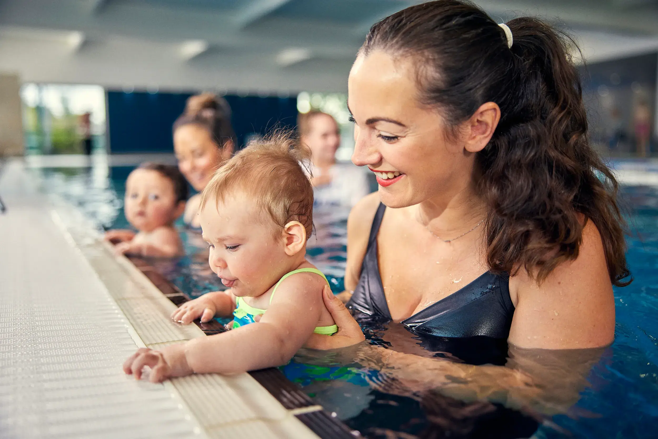 A mother and baby in the swimming pool
