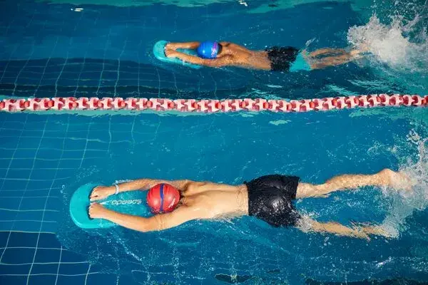 A young child being taught to swim by a David Lloyd swim instructor