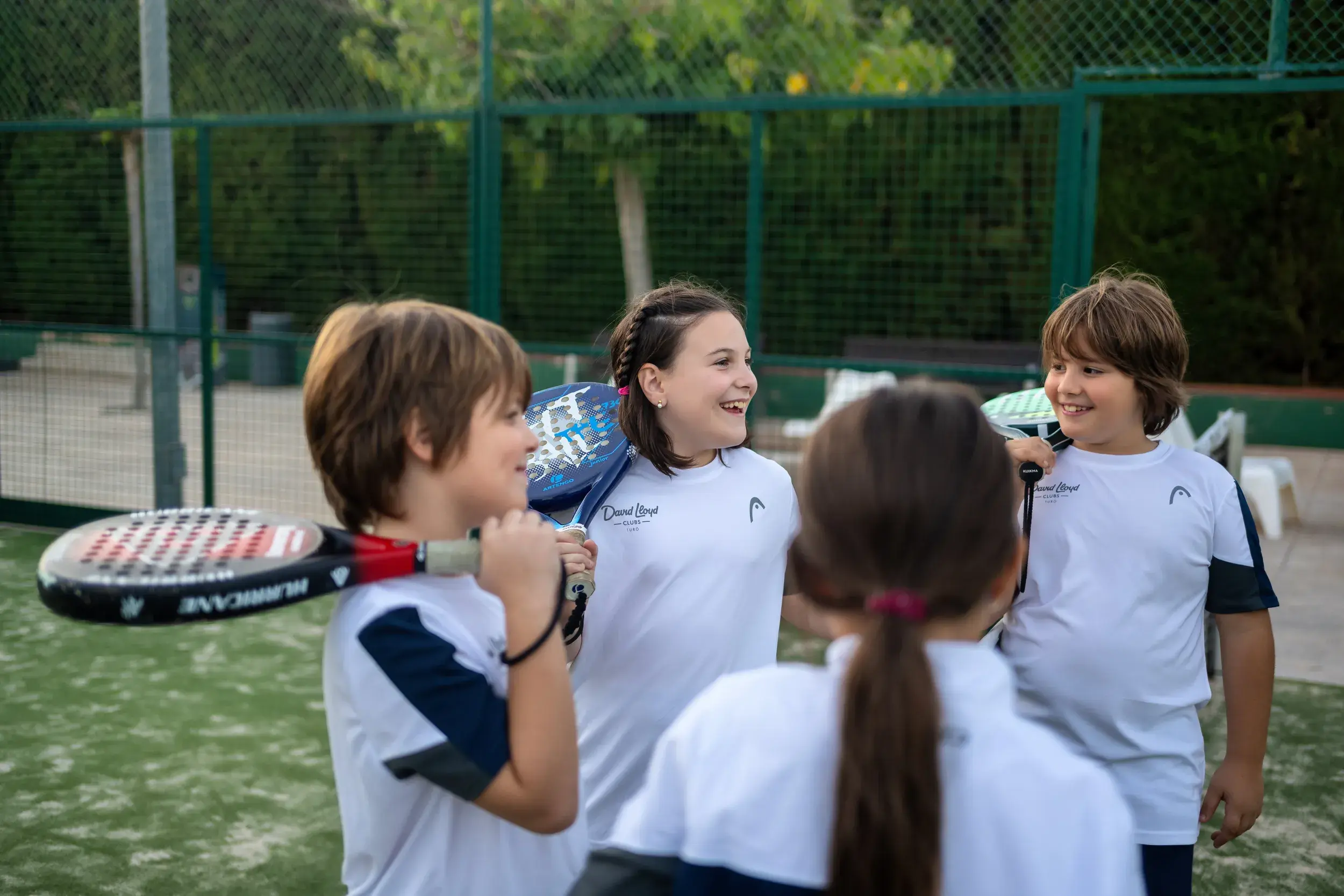 4 people playing a game of Padel