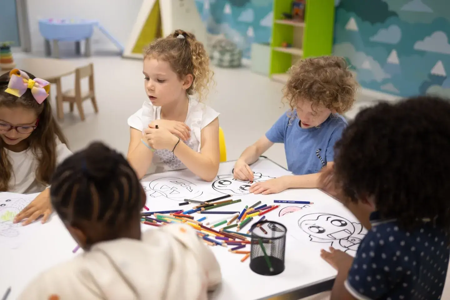 Children colouring at a table