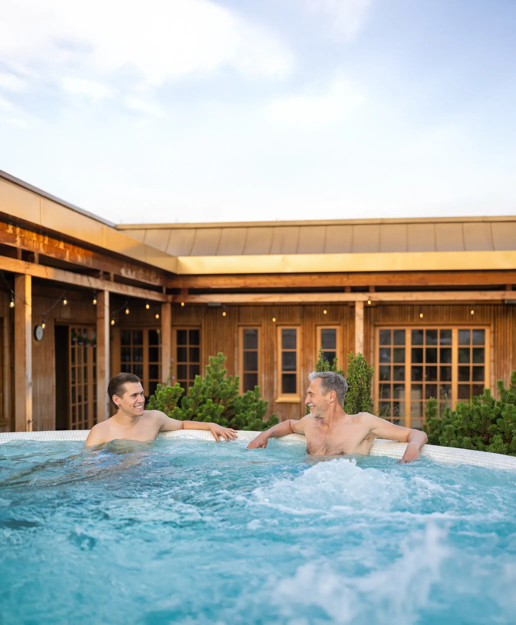 Two men chatting in the whirlpool at David Lloyd Frankfurt