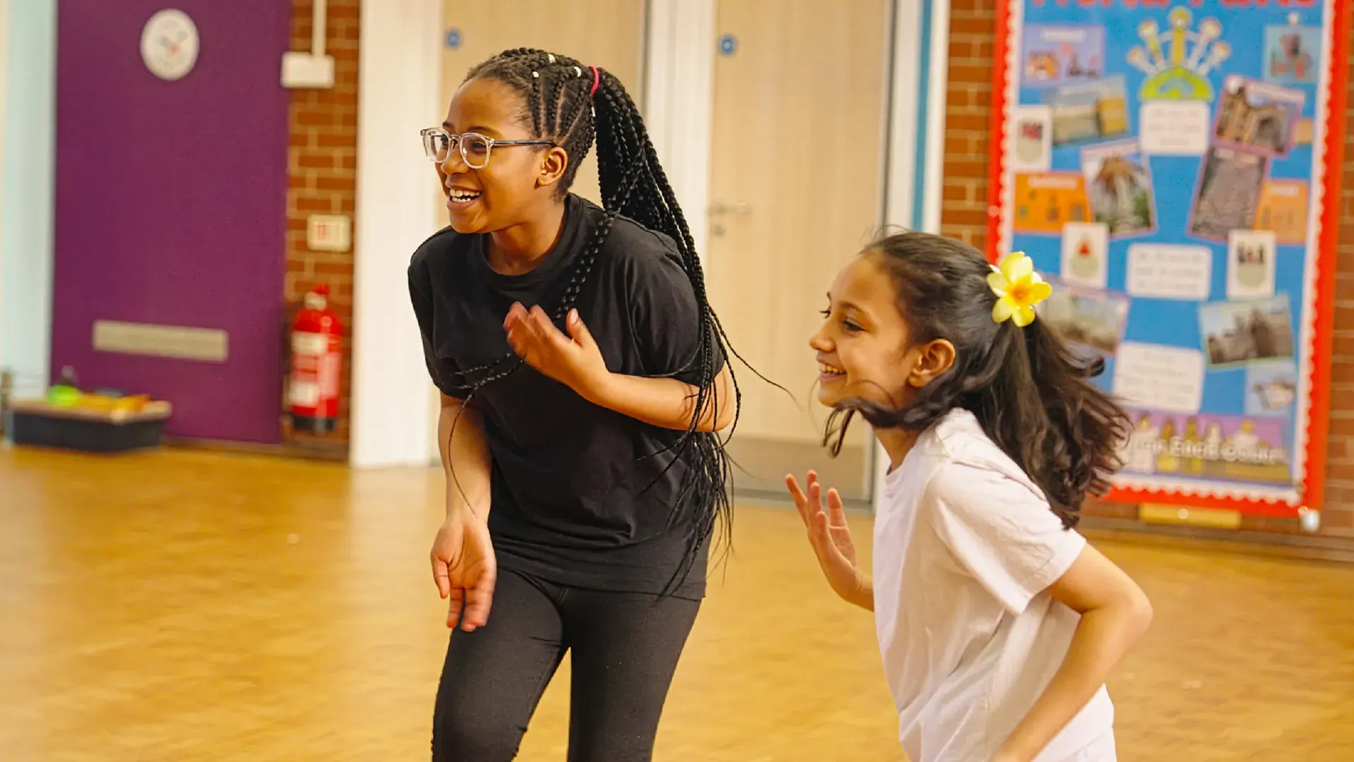 Two girls dancing together