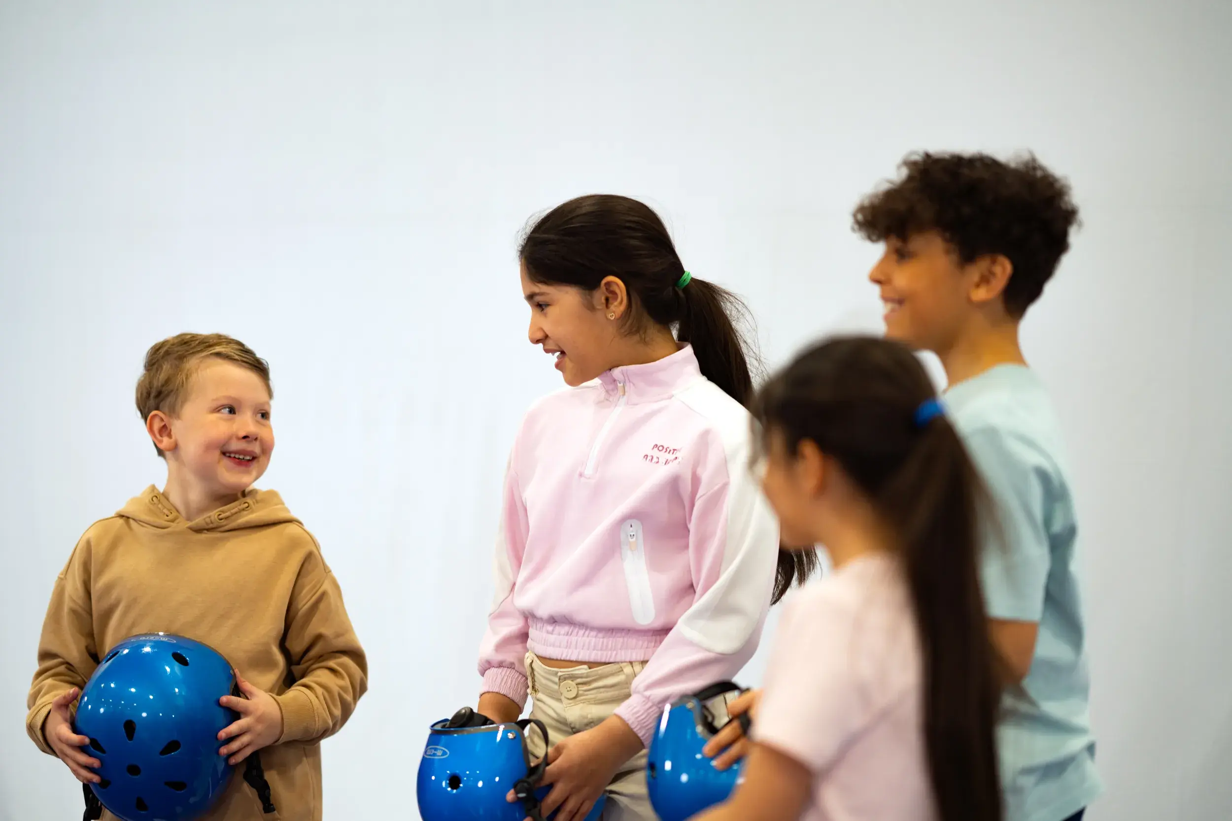 Children playing with soft stepping stones in a soft play area
