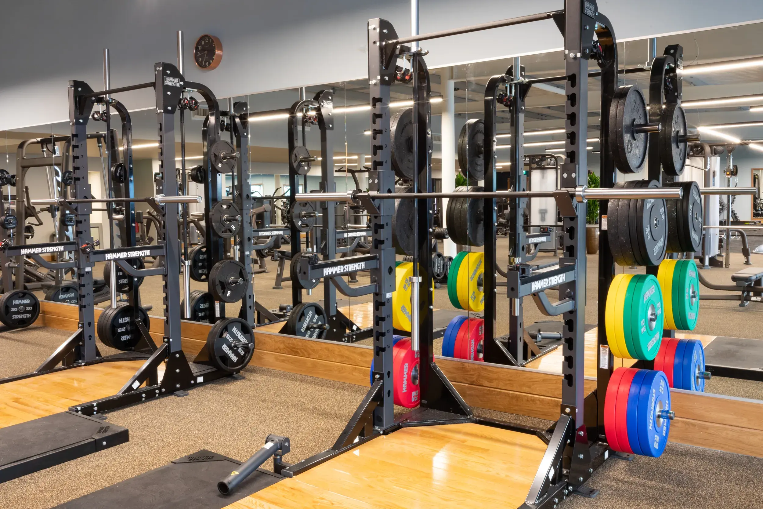 A rack of weights and Olympic lifting platforms