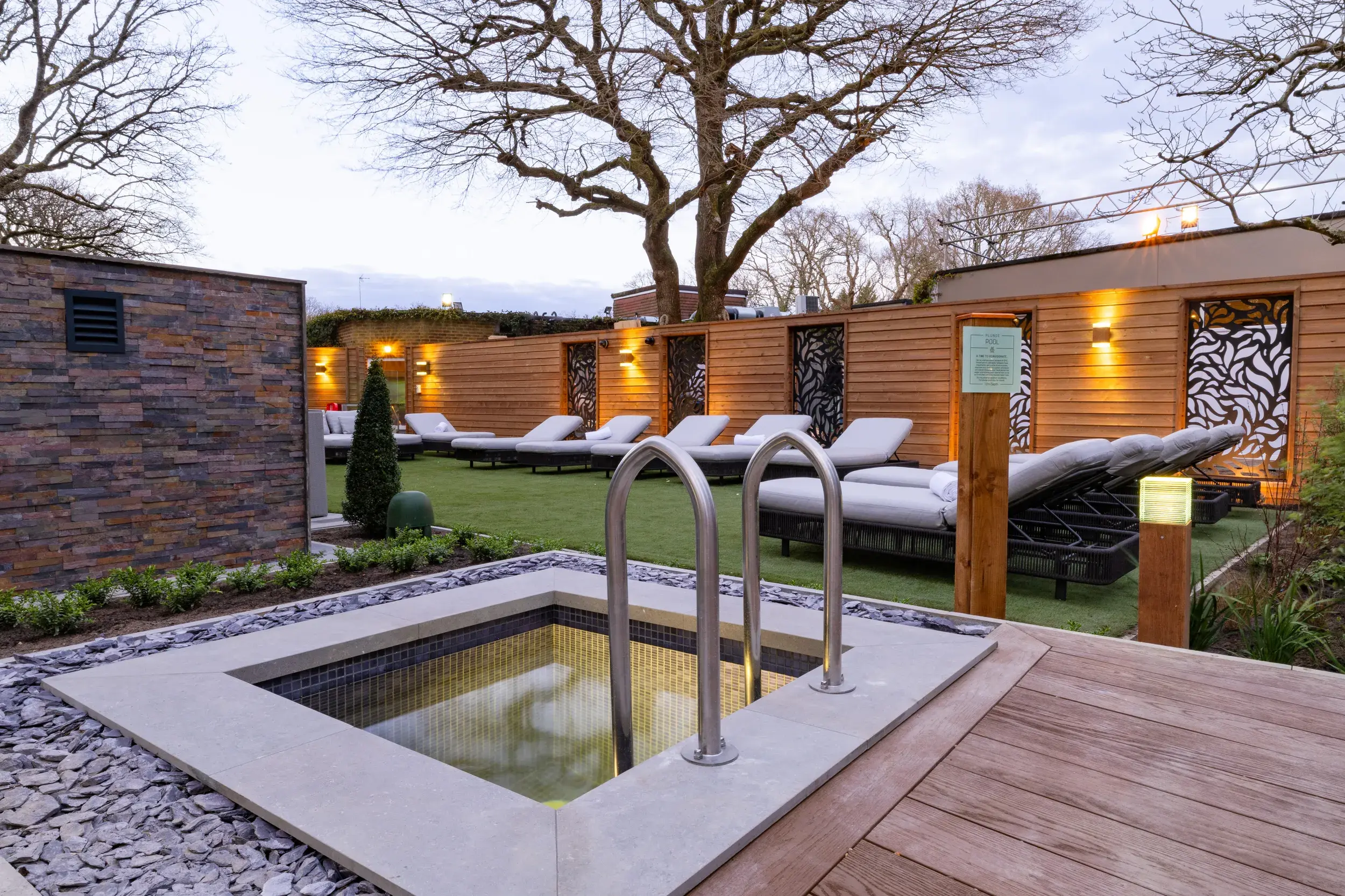 The plunge pool, situated in the Spa Garden, with wooden decking to the side
