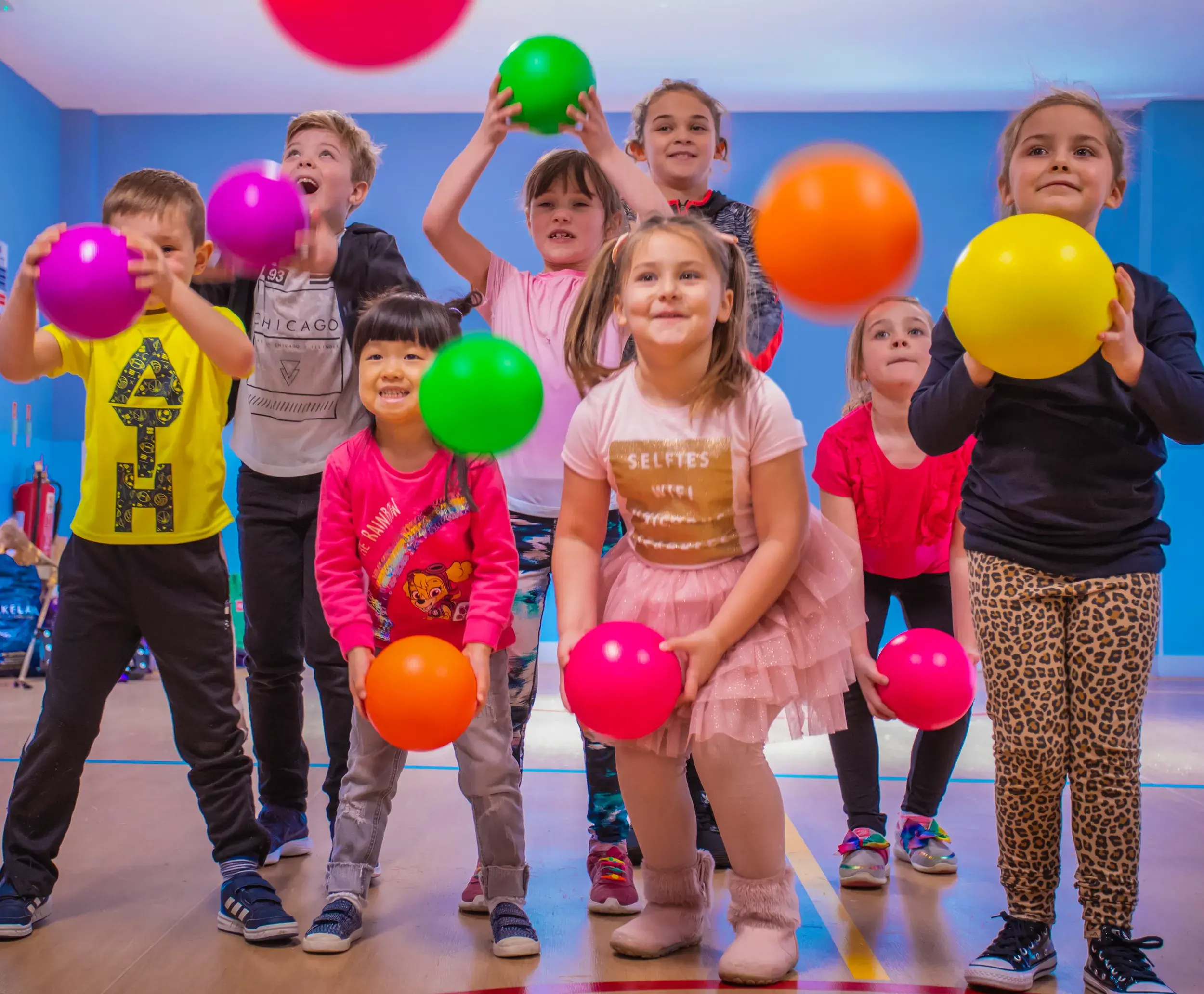 Kids holding balloons at a party