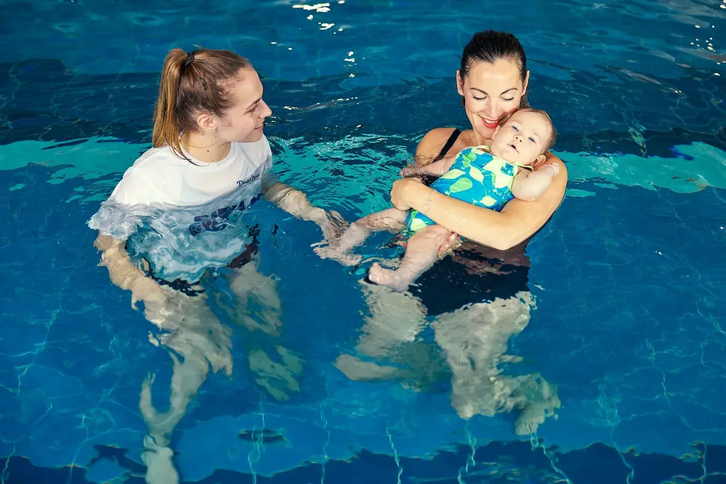 Our crèche staff playing with a toddler