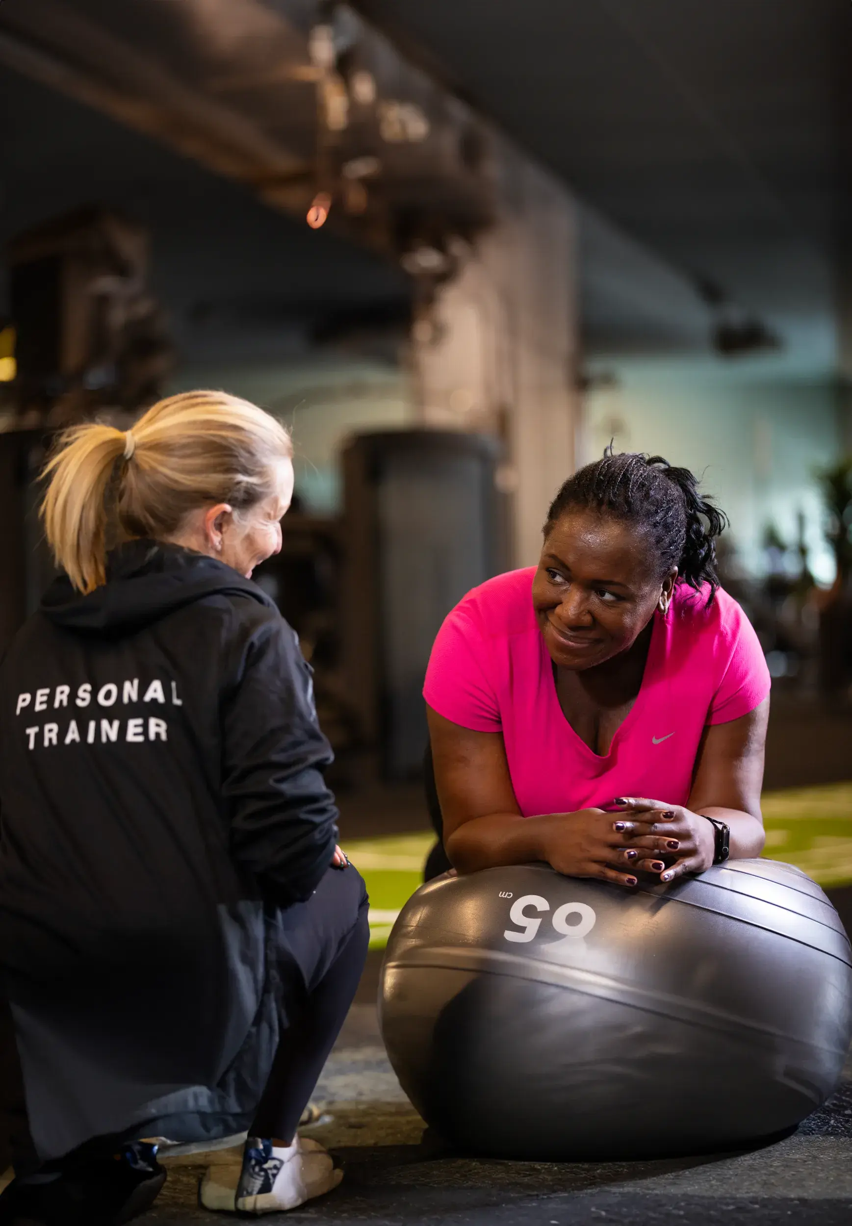 A woman working out with a personal trainer