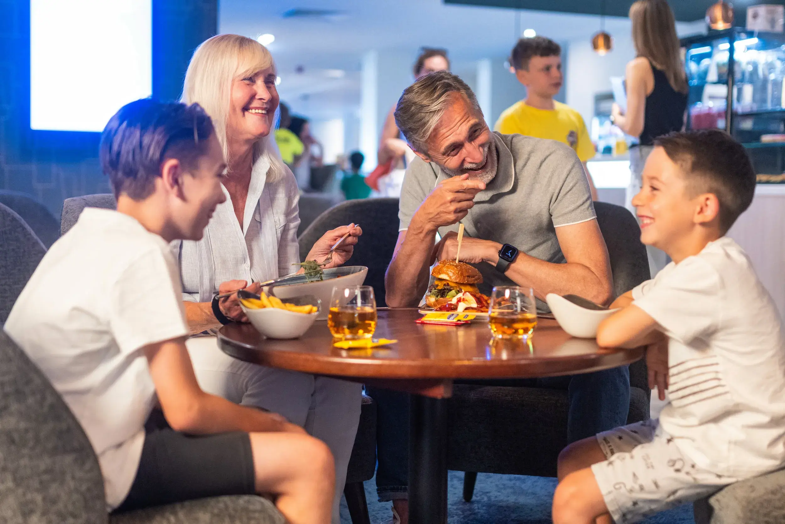A family enjoying a meal in the Clubroom 