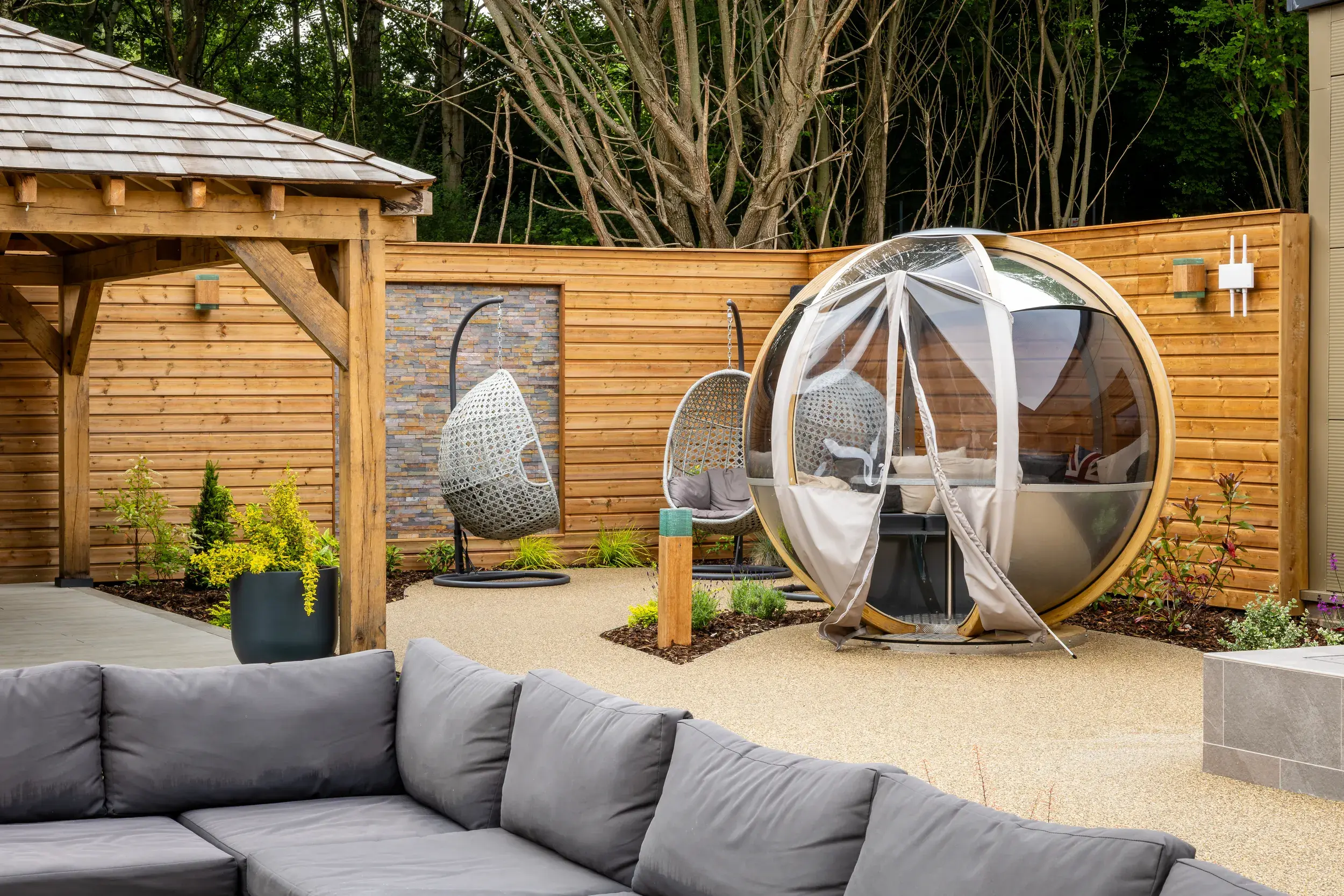 Comfy chairs and cocooning pods in our Spa Garden