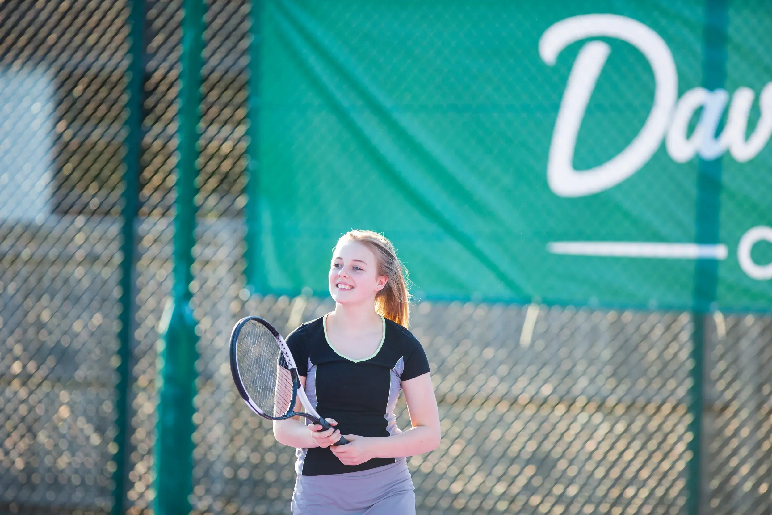 A teenager playing tennis