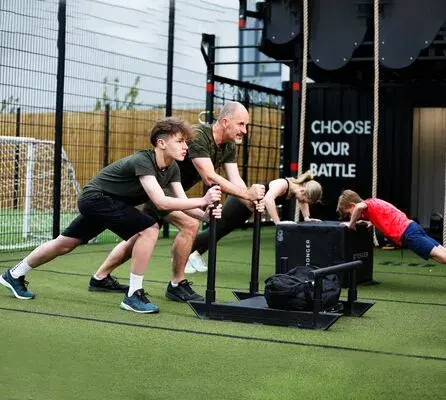 A father and son doing a REBELS BATTLEBOX class