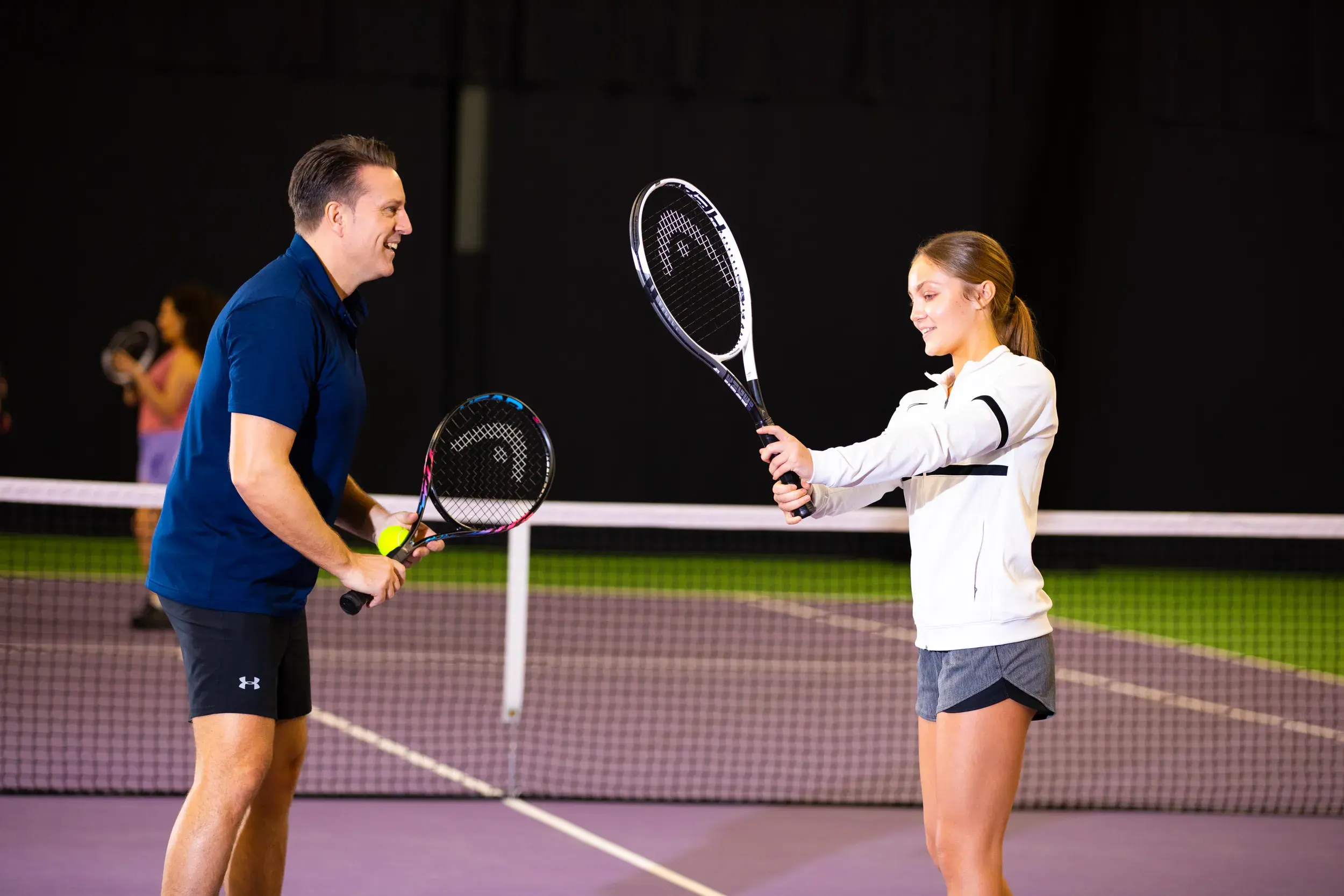 Two people playing tennis