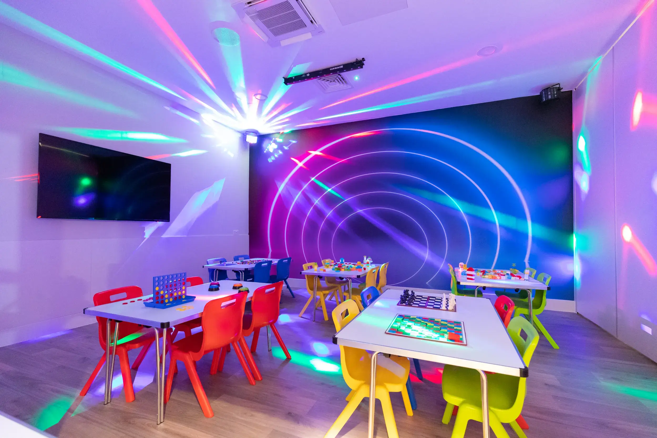 A young boy holding a tennis racquet