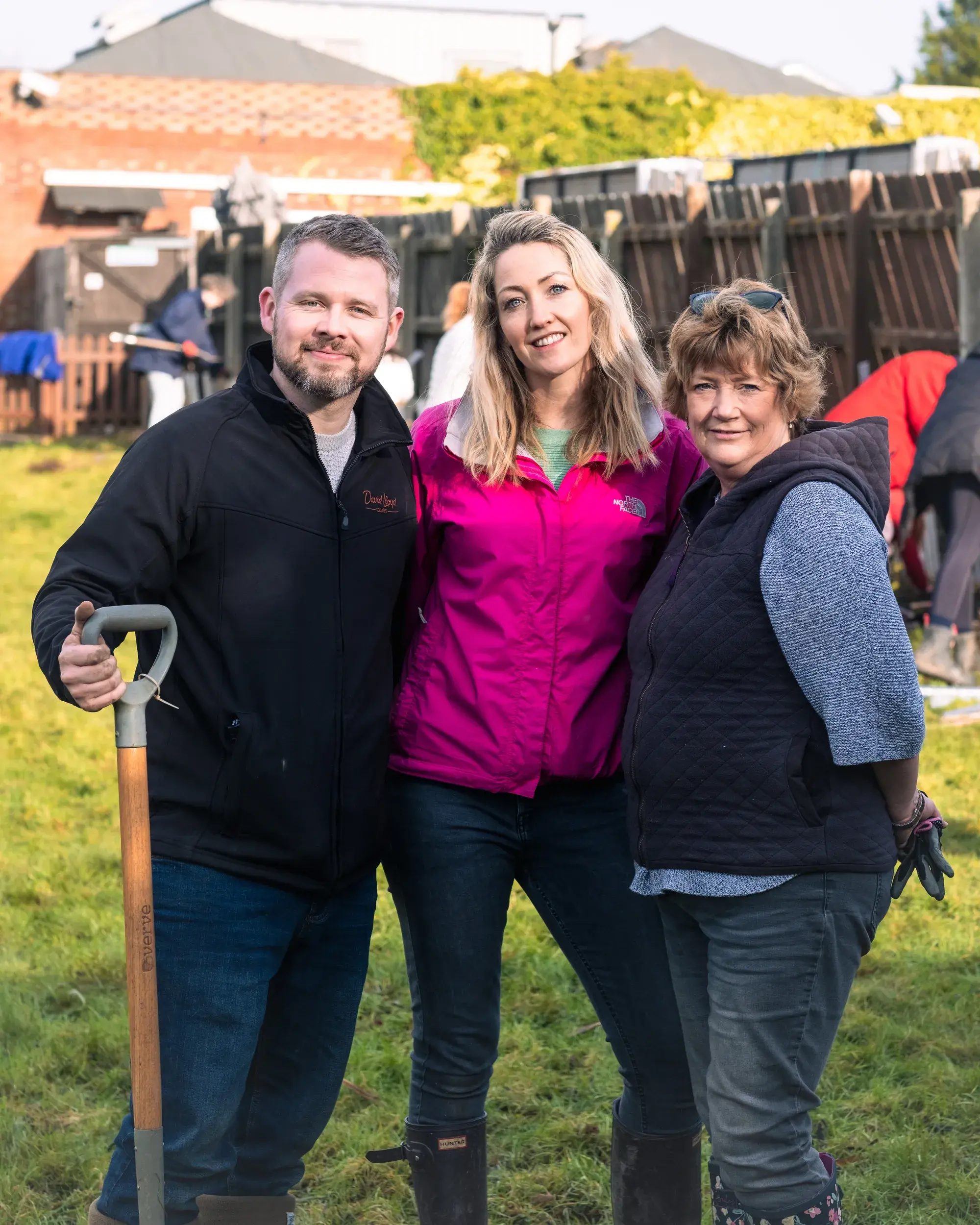 Team members at a gardening event