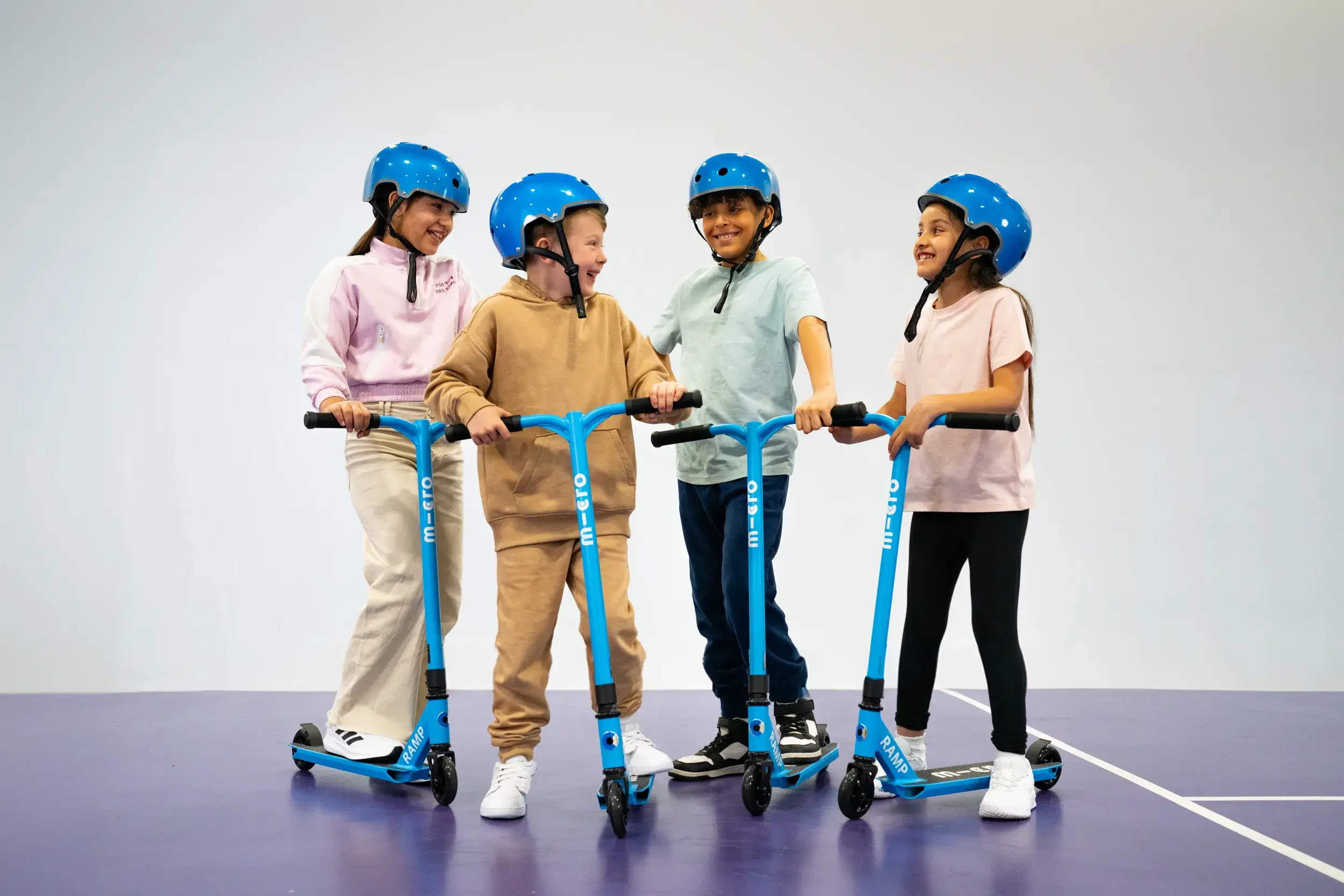 Four children on scooters