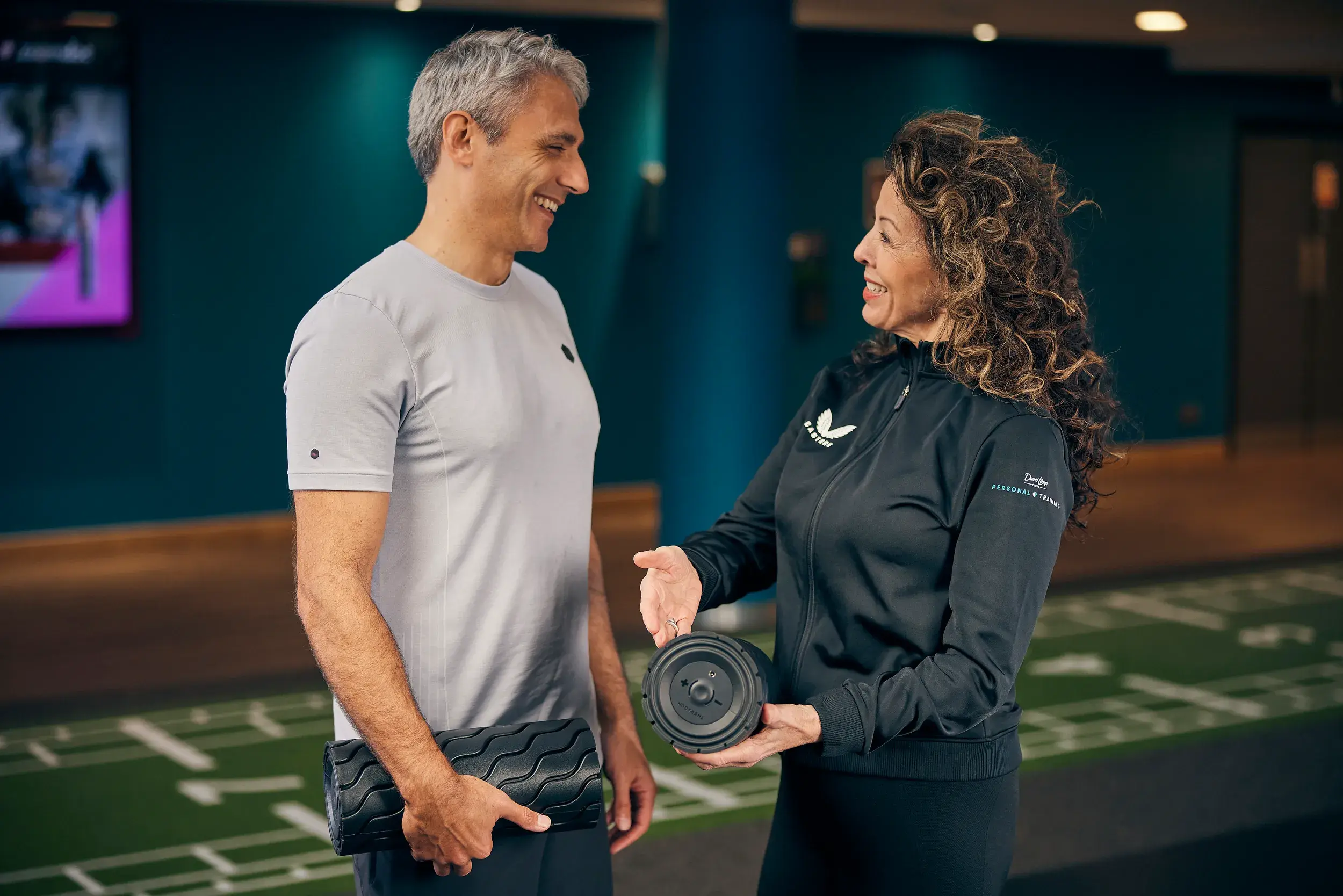A woman working out with a personal trainer